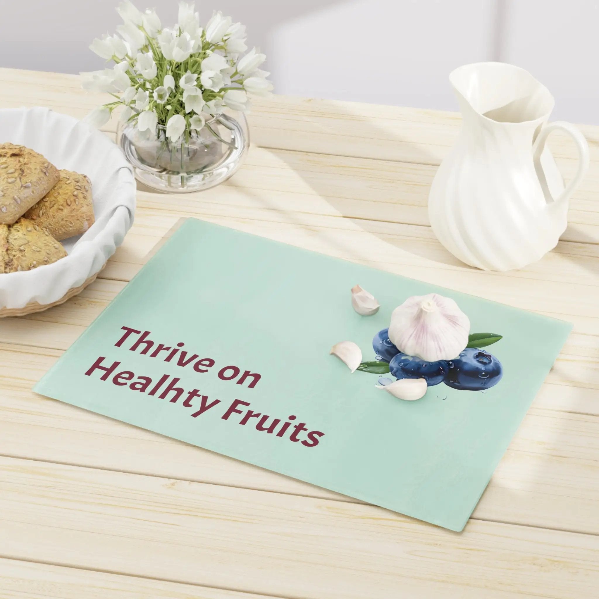 Cutting board | a table topped with a bowl of cookies and a plate of cookies