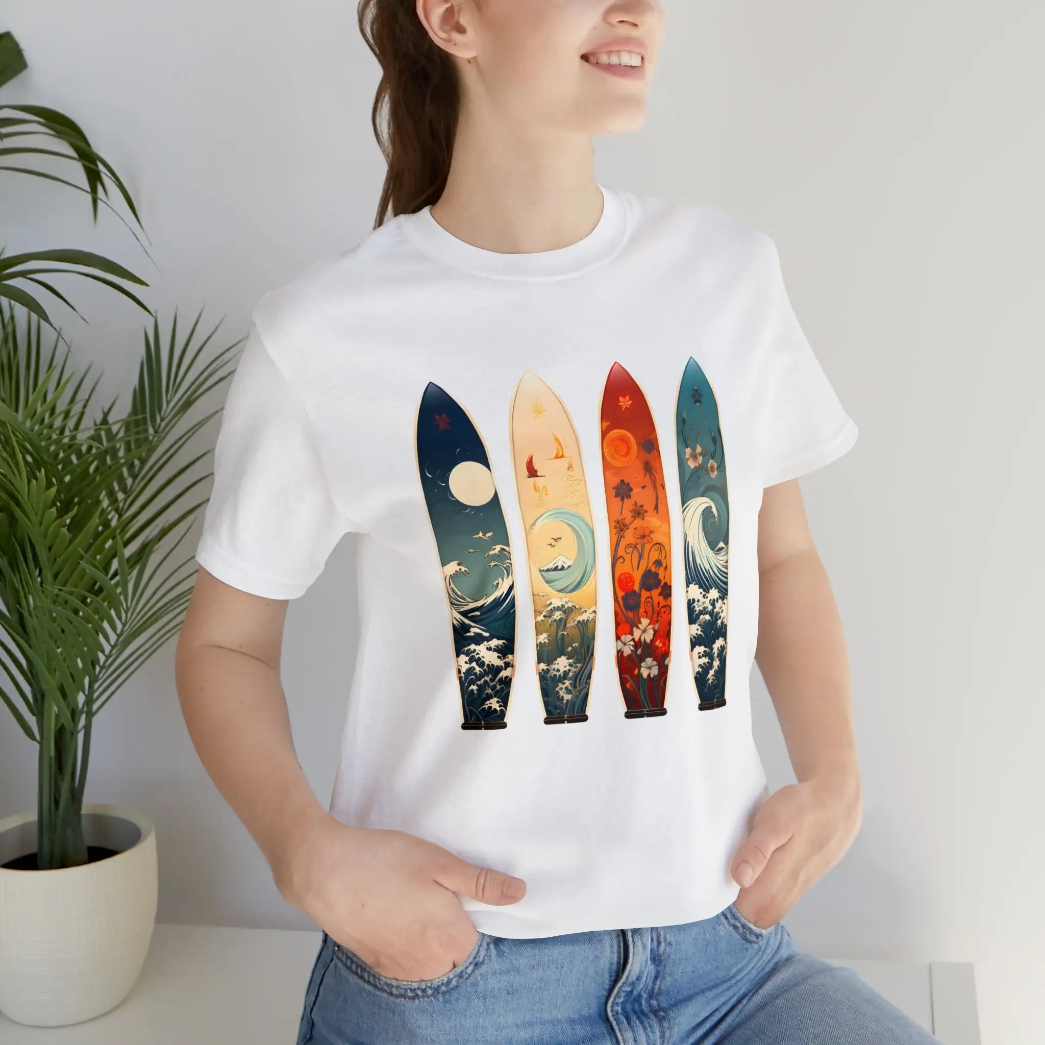 Couple t shirt | a woman wearing a t - shirt with four surfboards on it