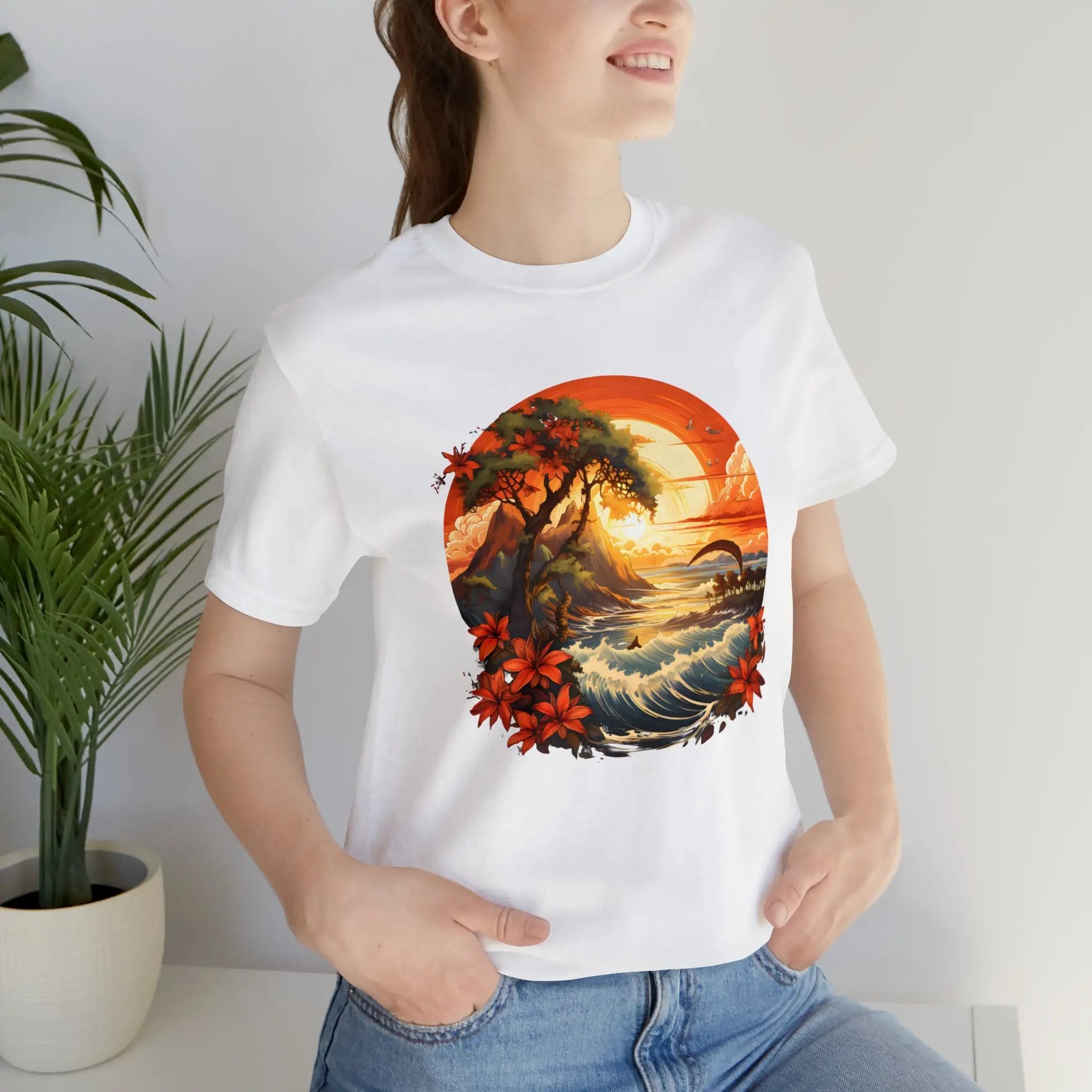 Couple t shirt | a woman wearing a white t - shirt with a painting of a sunset