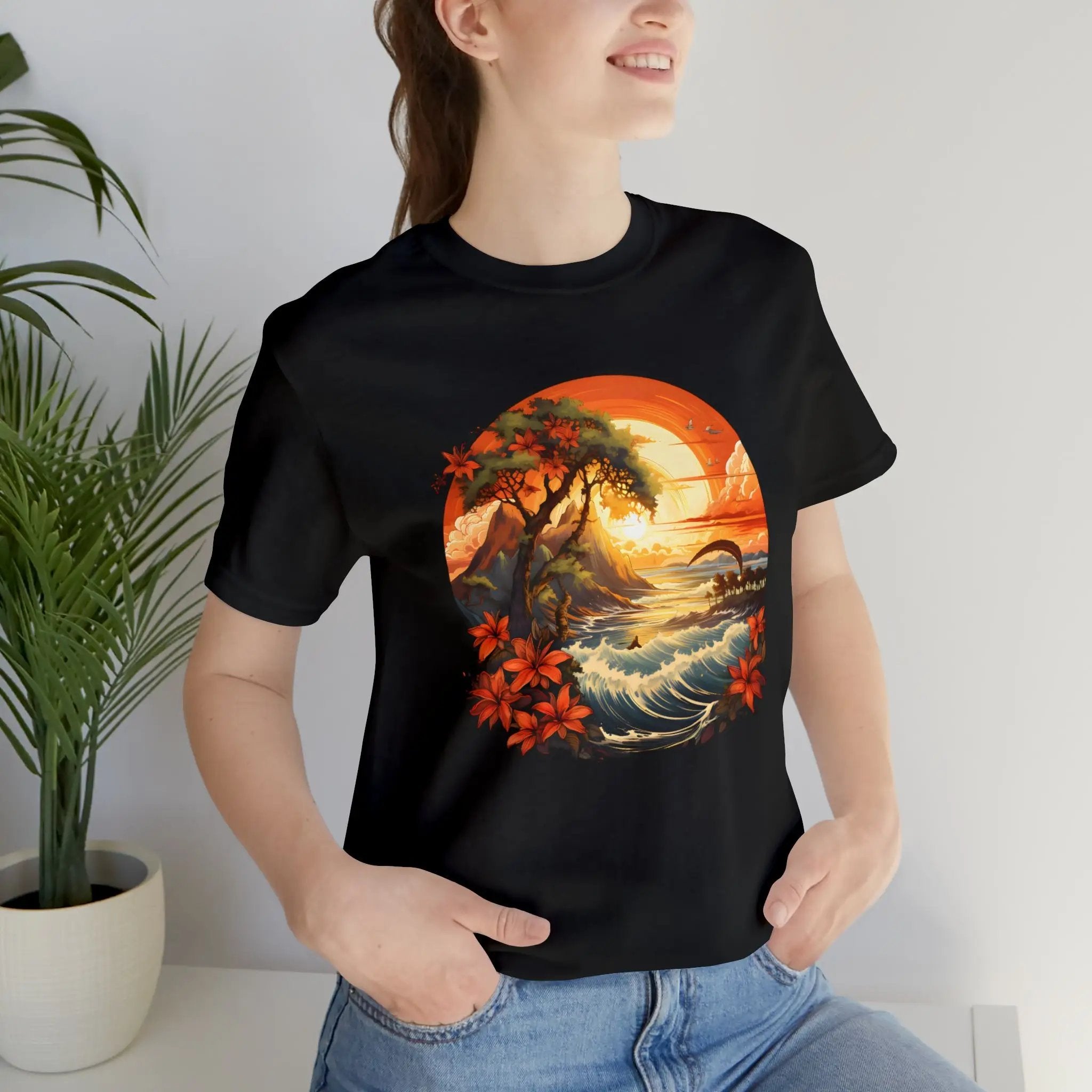 Couple t shirt | a woman wearing a black t - shirt with a painting of a sunset