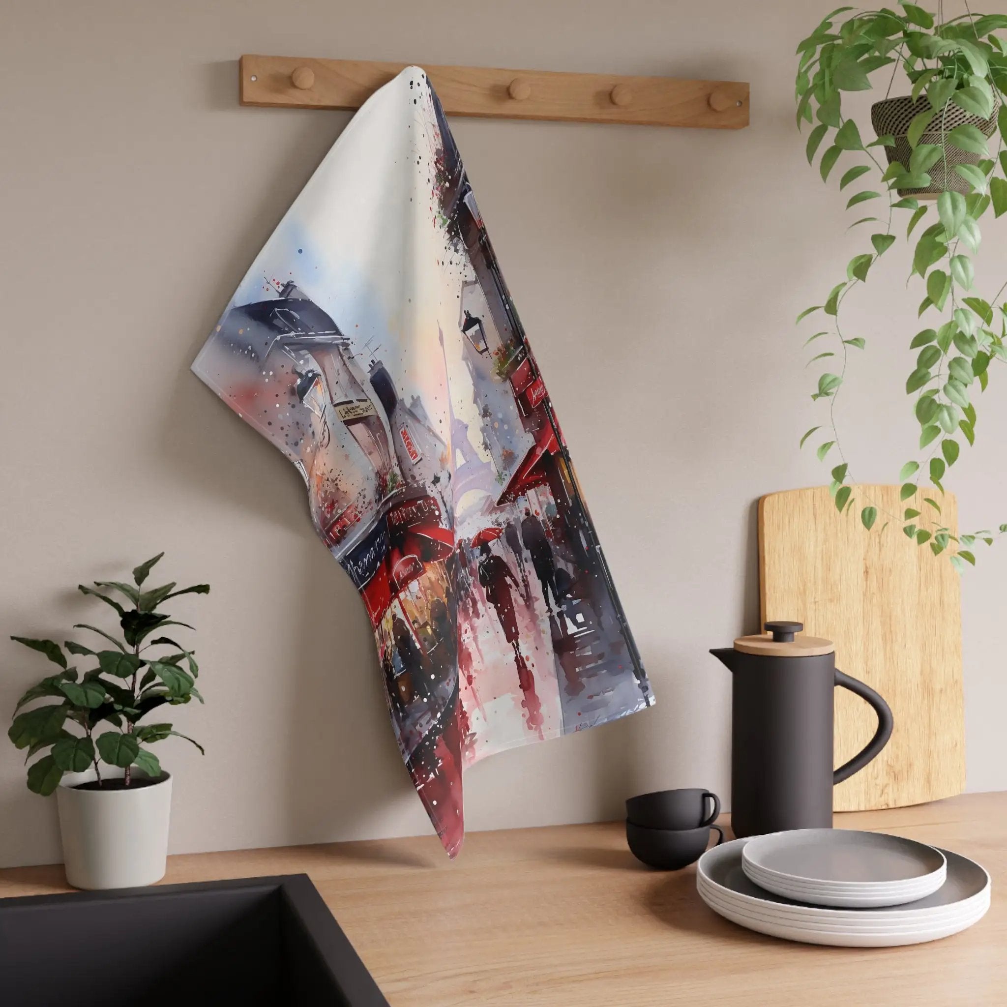 Kitchen Towel | a tea towel hanging on a wall next to a potted plant