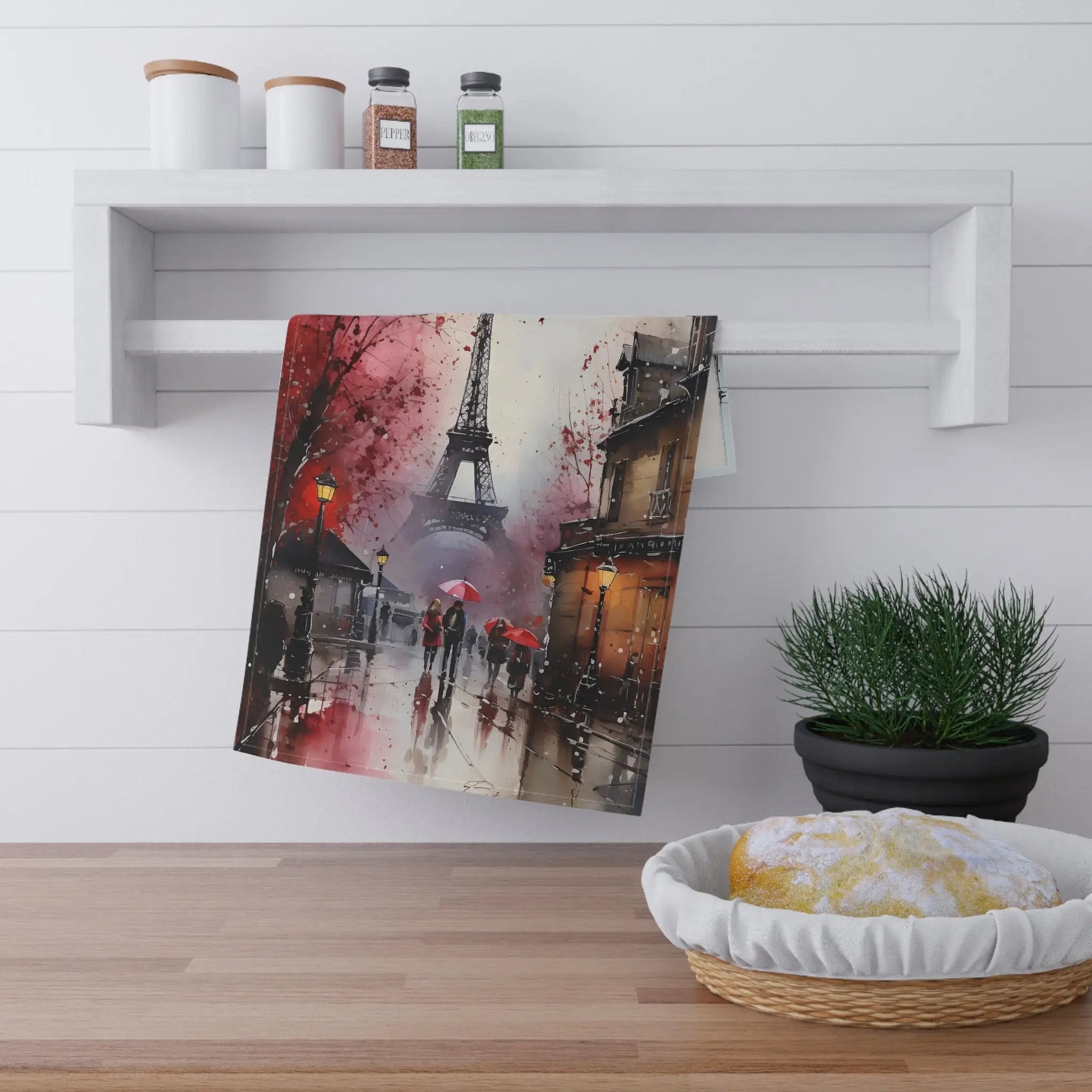 Kitchen Towel | a painting hanging on a wall next to a potted plant