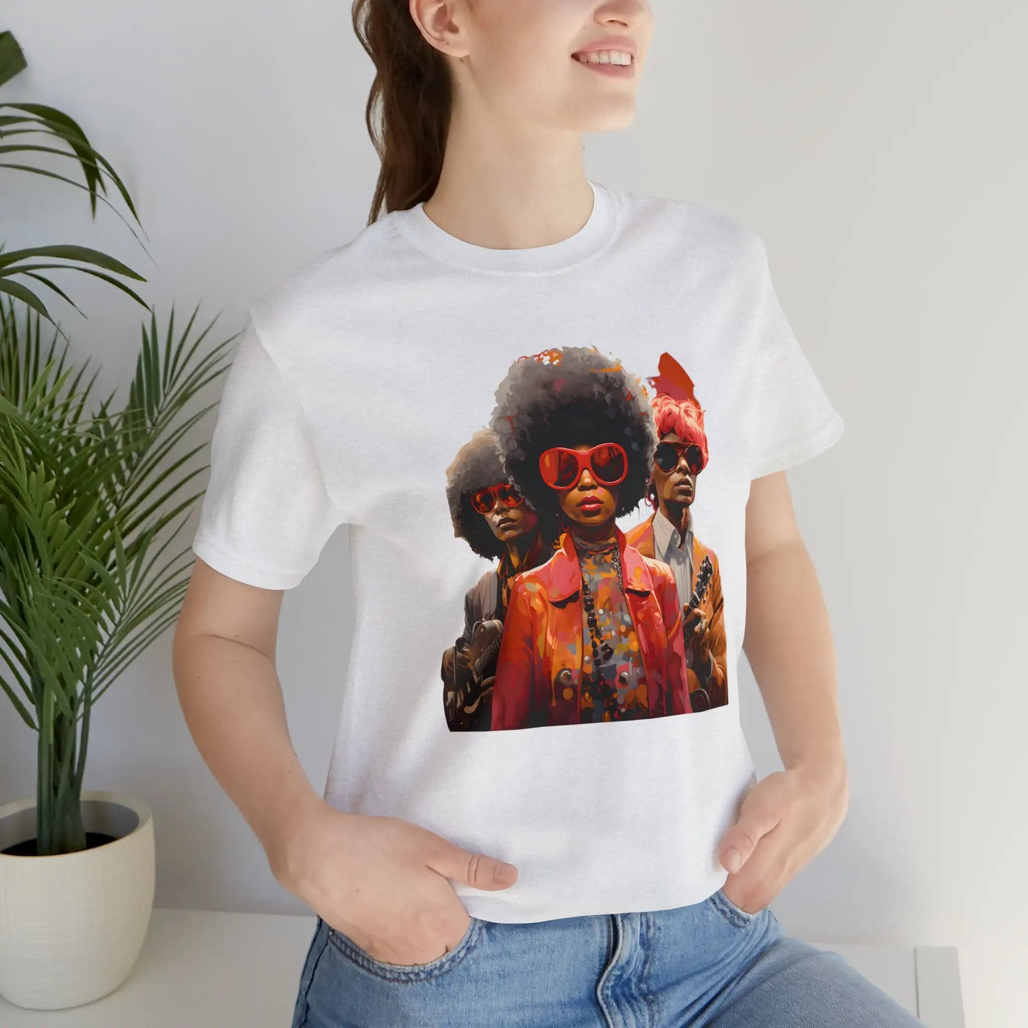 Couple t shirt | a woman wearing a white t - shirt with a picture of two black women