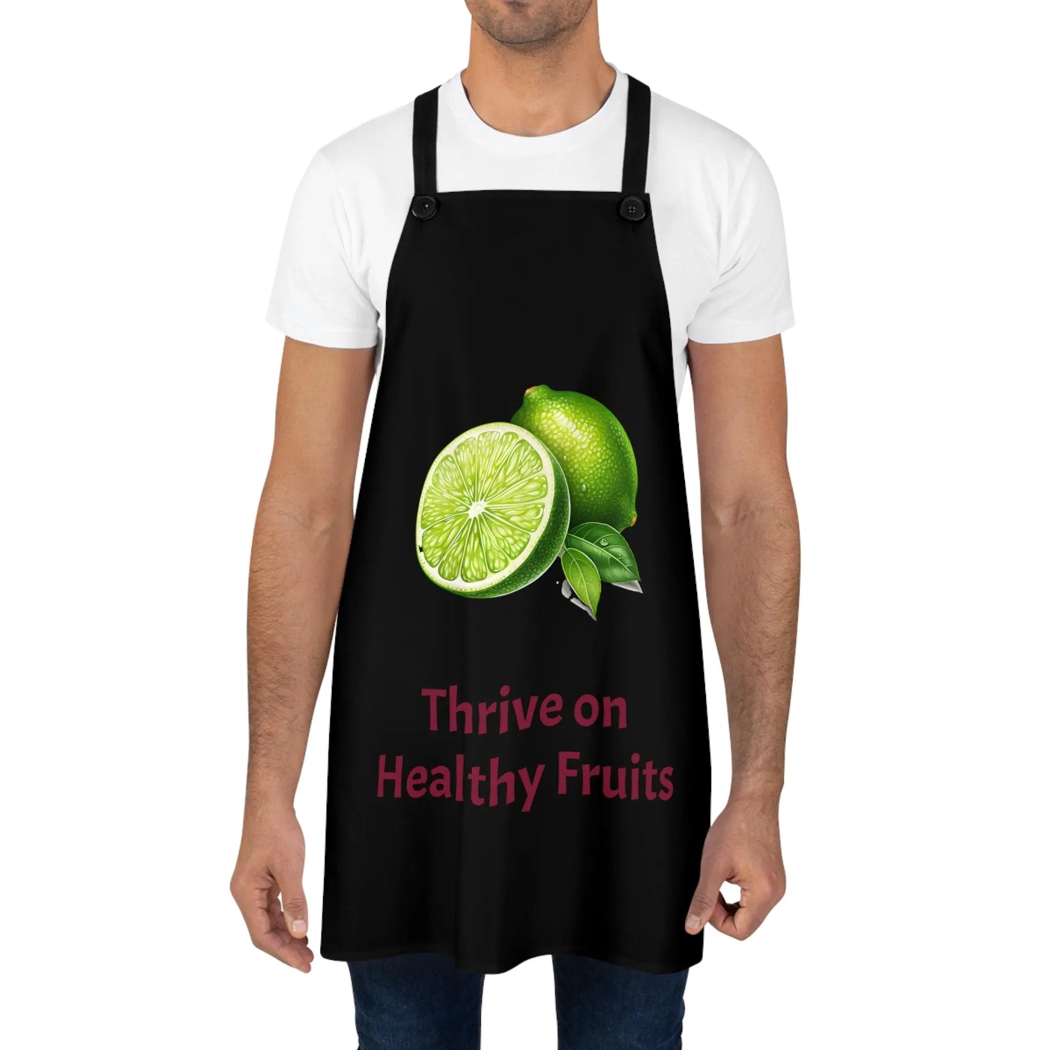 Chef Apron | a man wearing a black apron with a lime on it