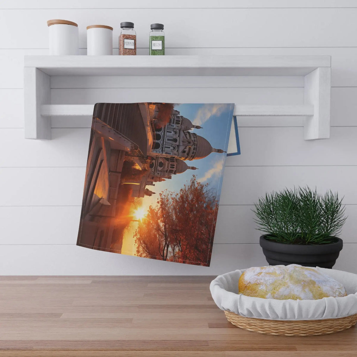 Kitchen Towel | a photo of a sunset hanging on a wall