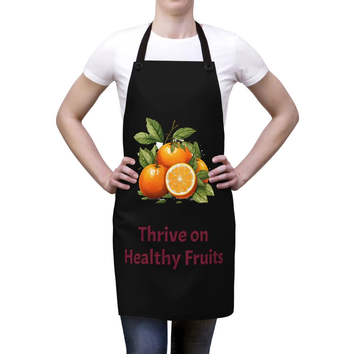 Chef Apron | a woman wearing a black apron with oranges on it