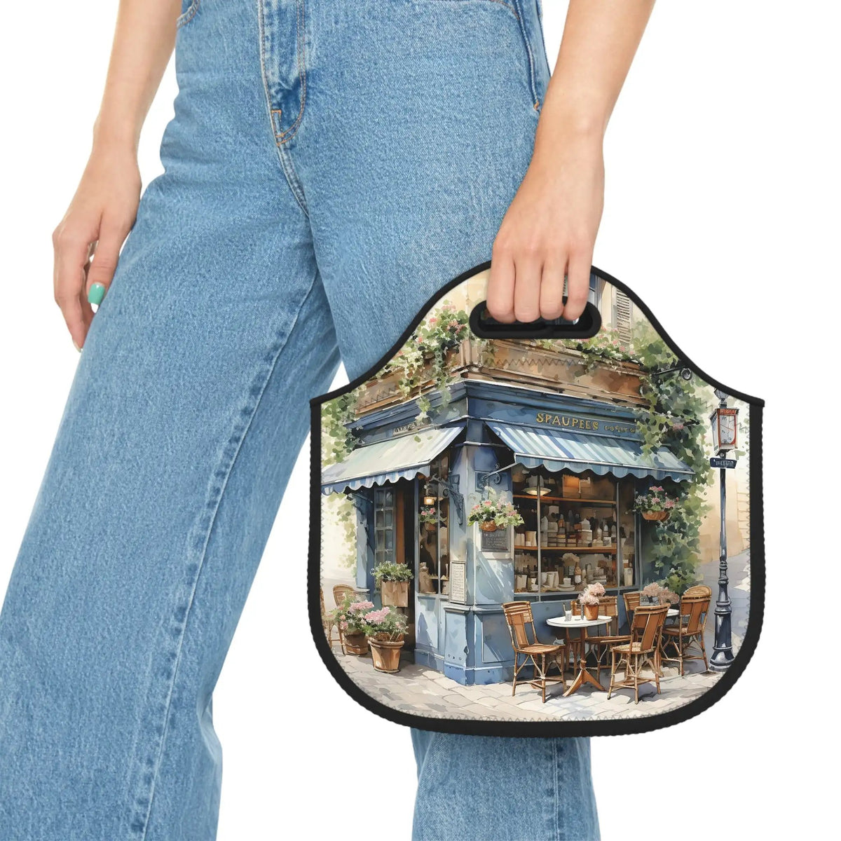 Insulated lunch bag | a woman holding a small purse with a picture of a restaurant on it