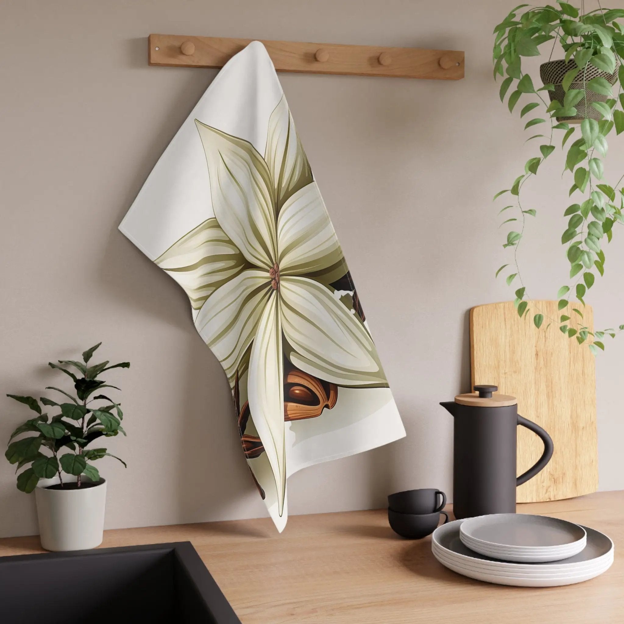 Kitchen Towel | a kitchen counter with a potted plant and a teapot