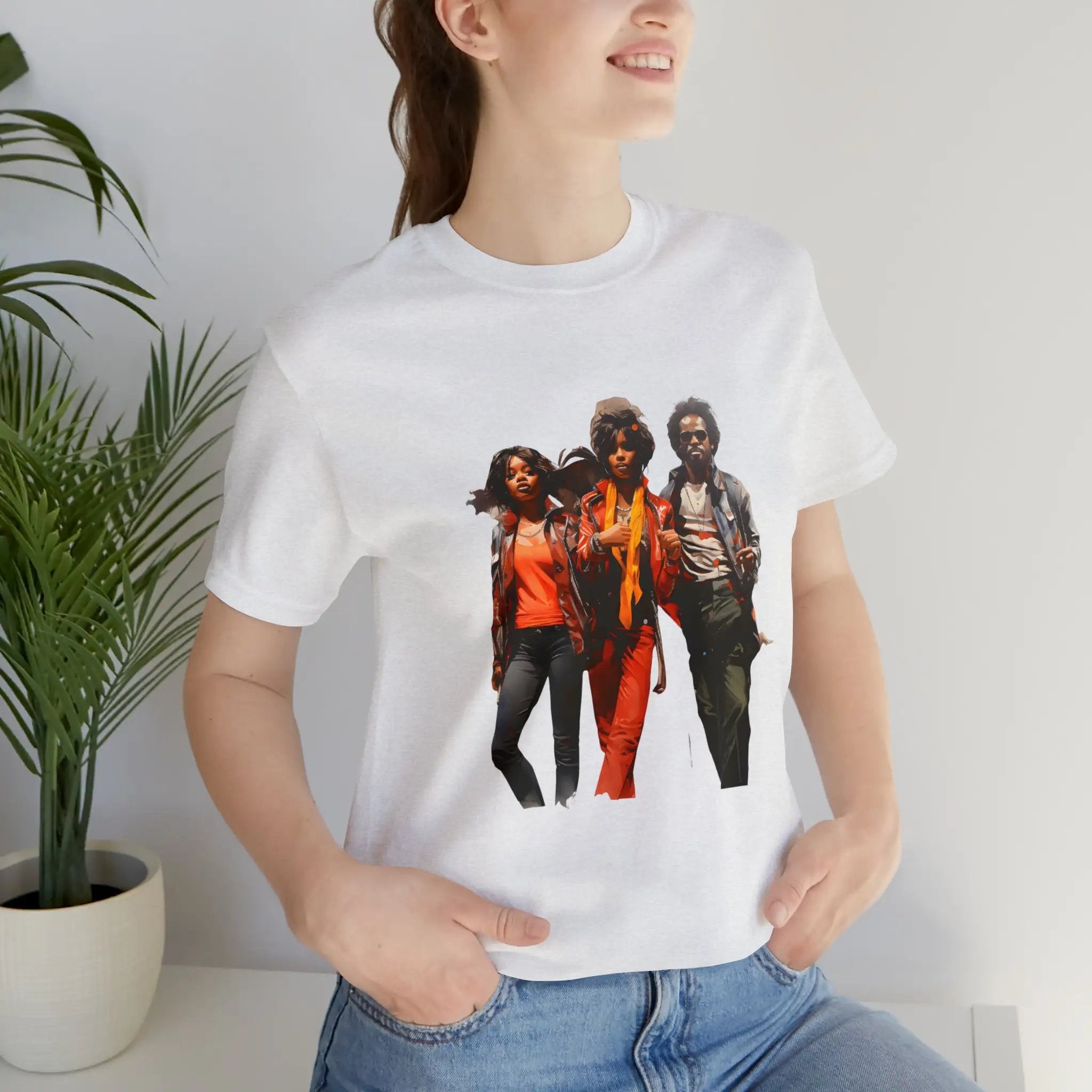 Couple t shirt | a woman wearing a white t - shirt with a group of women on it