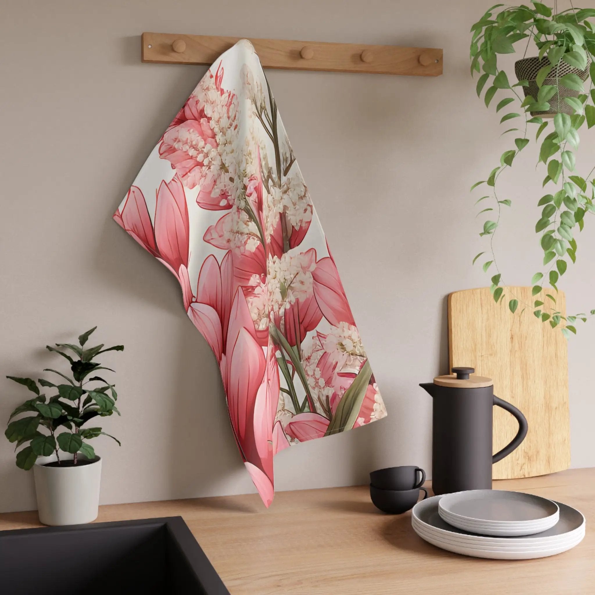 Kitchen Towel | a kitchen counter with a potted plant and a tea towel hanging on the wall