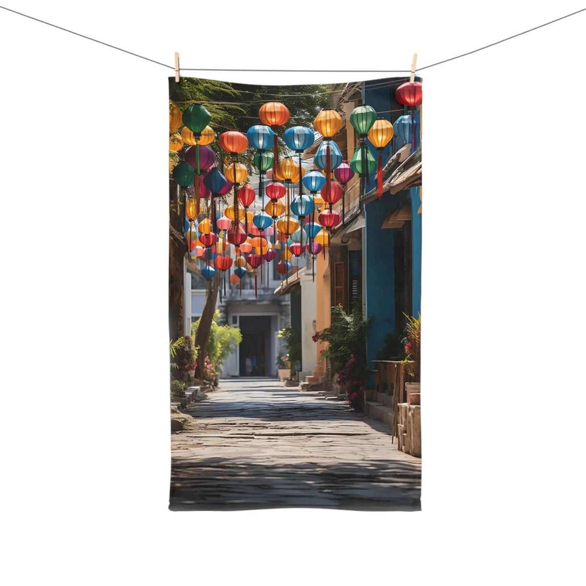 Hand towel | a street with a bunch of colorful lanterns hanging from the side of it