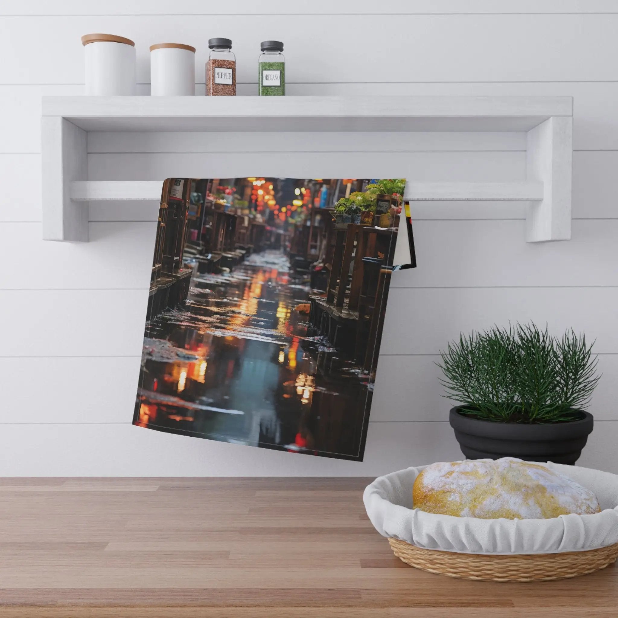 Kitchen Towel | a picture of a city street is hanging on a wall