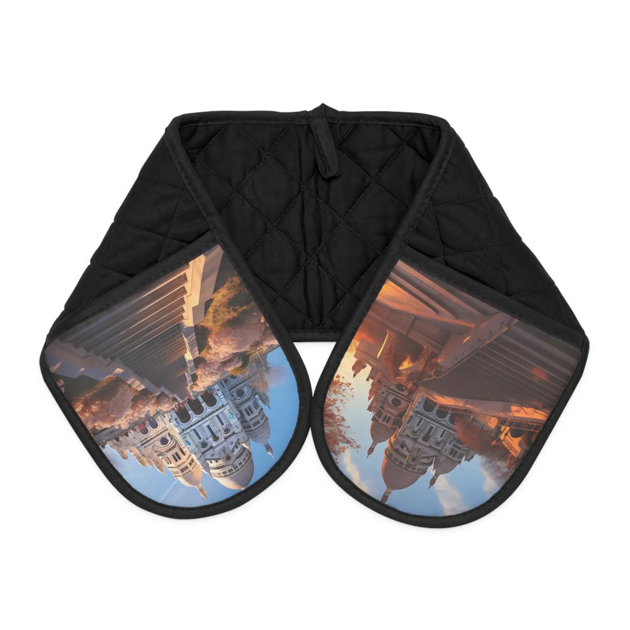 oven glove | a black oven mitt with a reflection of a building in it