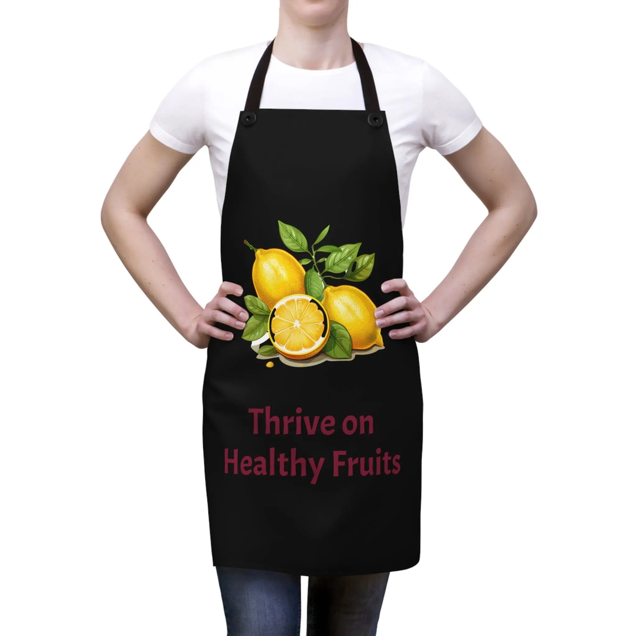 Chef Apron | a woman wearing a black apron with oranges on it