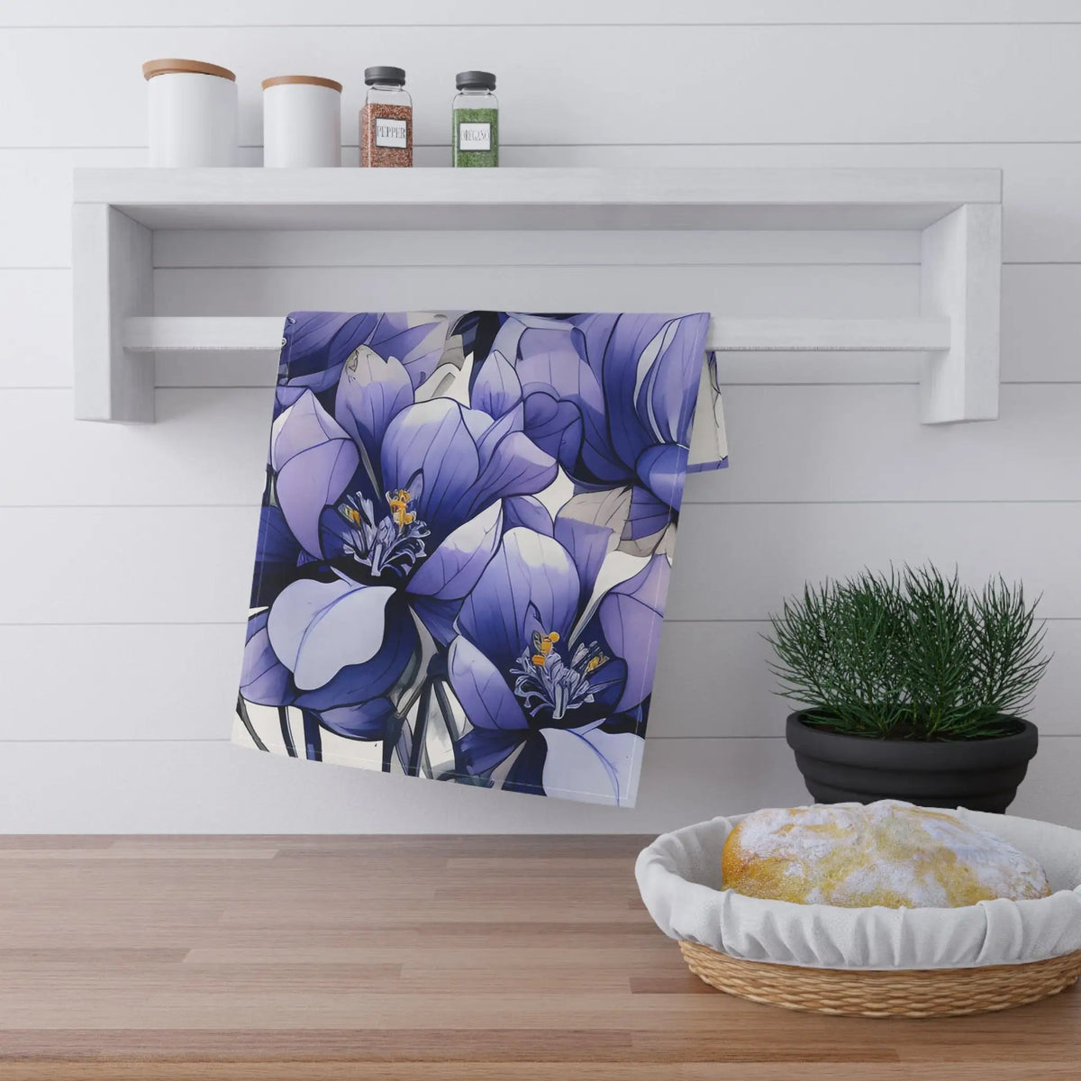 Kitchen Towel | a blue flower is hanging on a white wall