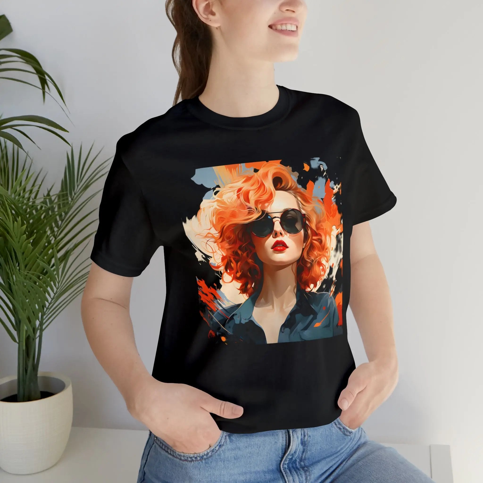 Couple t shirt | a woman wearing a black t - shirt with a picture of a woman wearing sunglasses