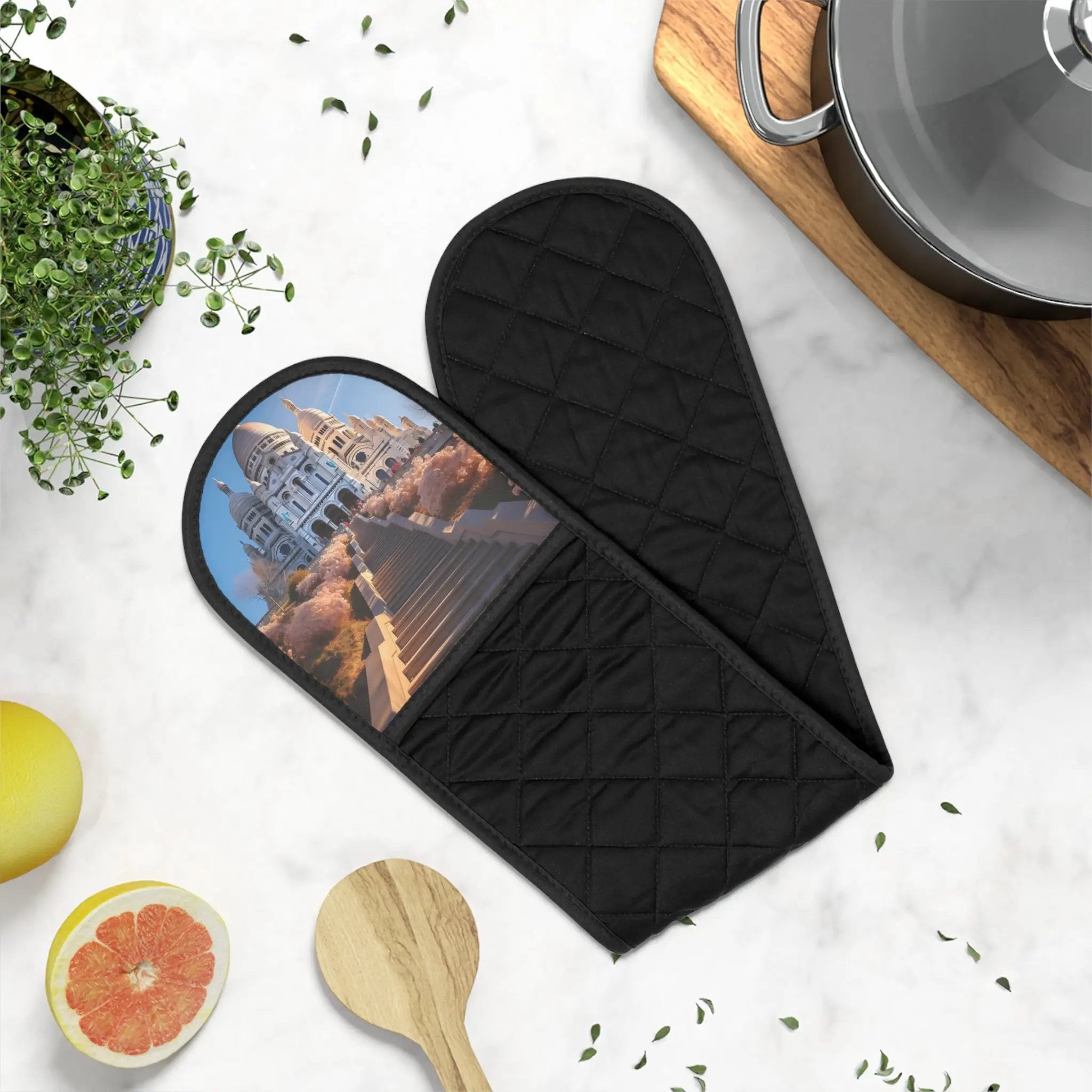 oven glove | a pair of oven mitts sitting on top of a counter