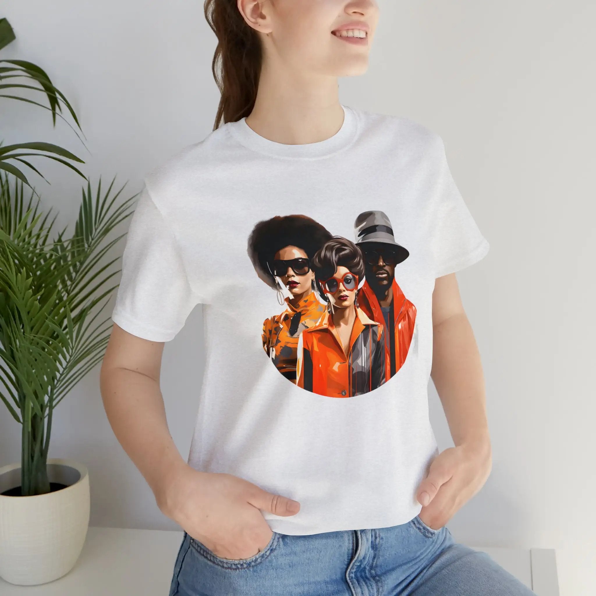 Couple t shirt | a woman wearing a white t - shirt with a picture of three men on it