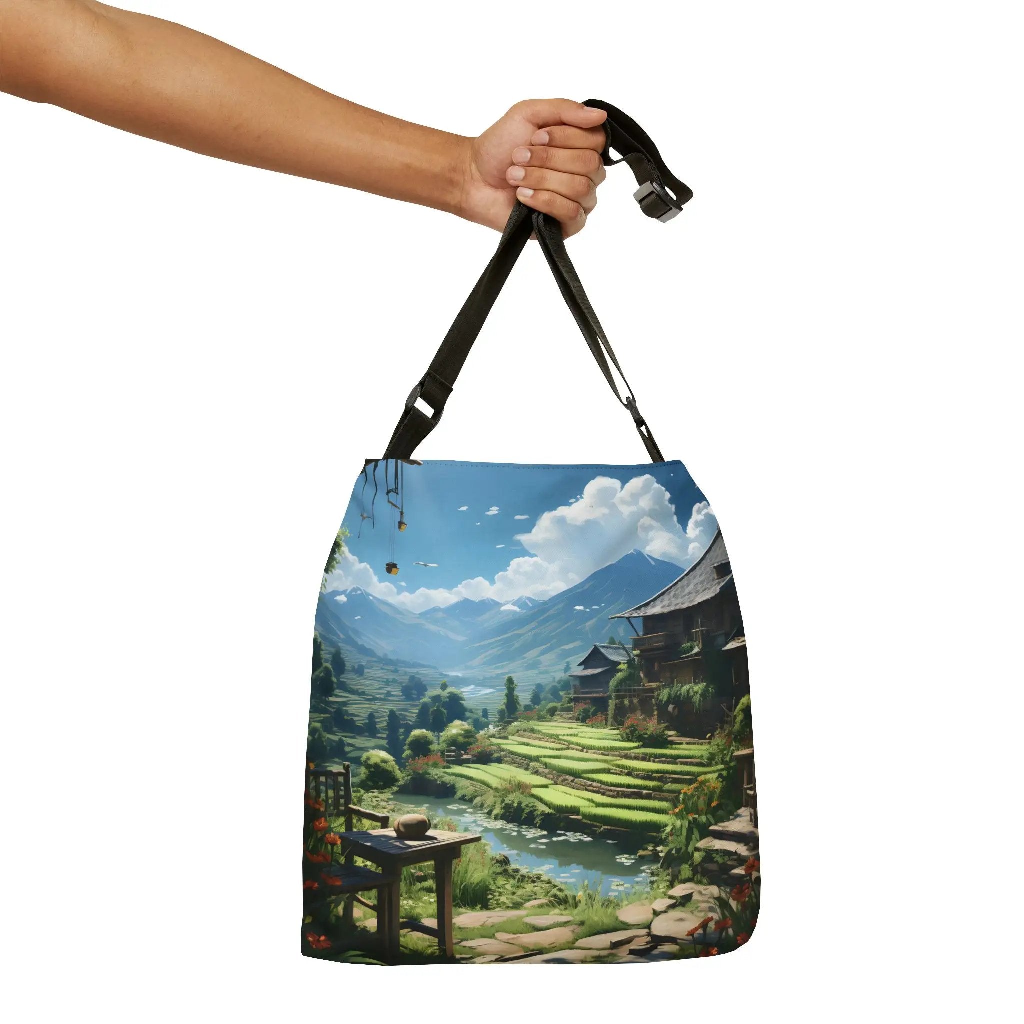 Weekender tote bag | a hand holding a bag with a painting of a landscape