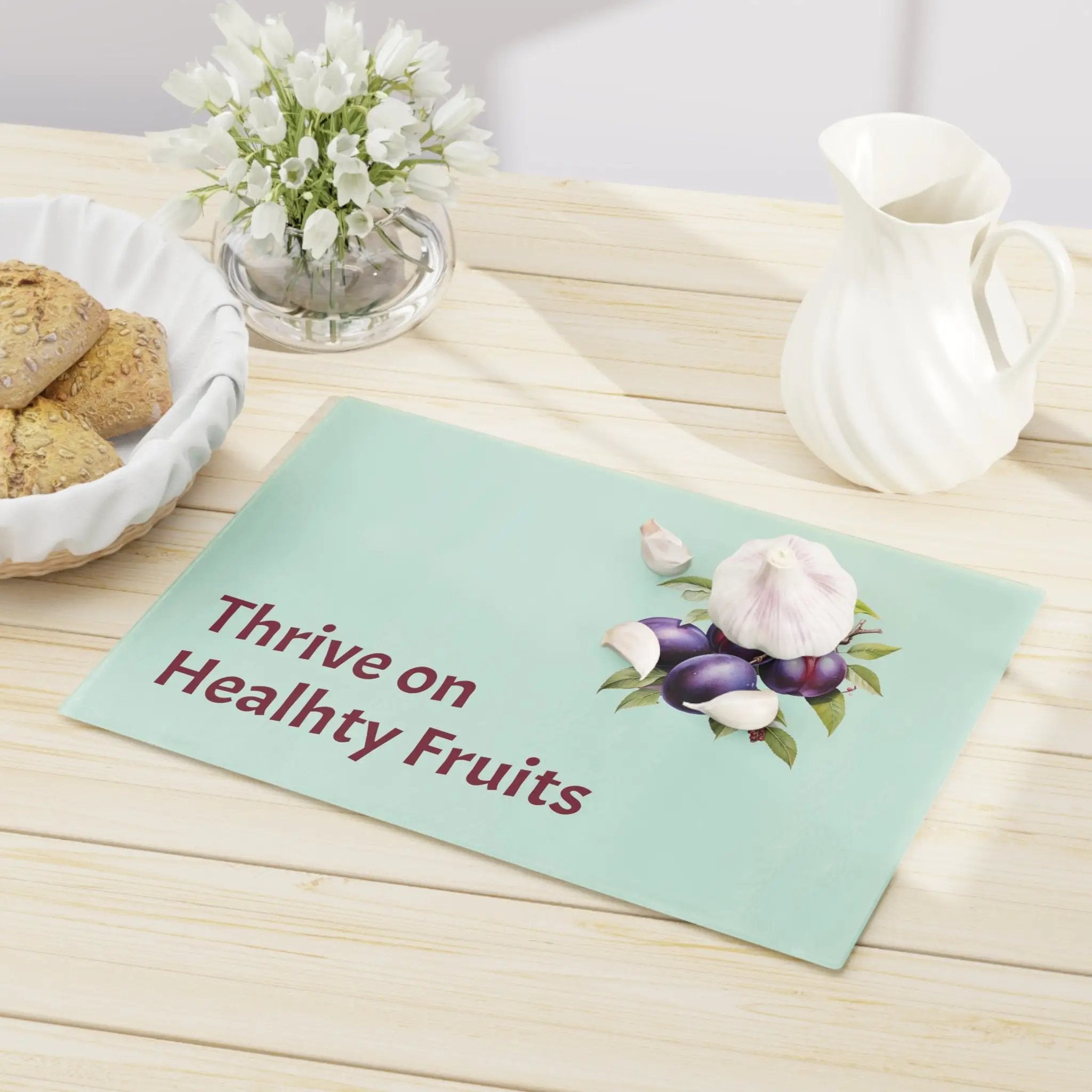 Cutting board | a table topped with a bowl of cookies and a plate of cookies