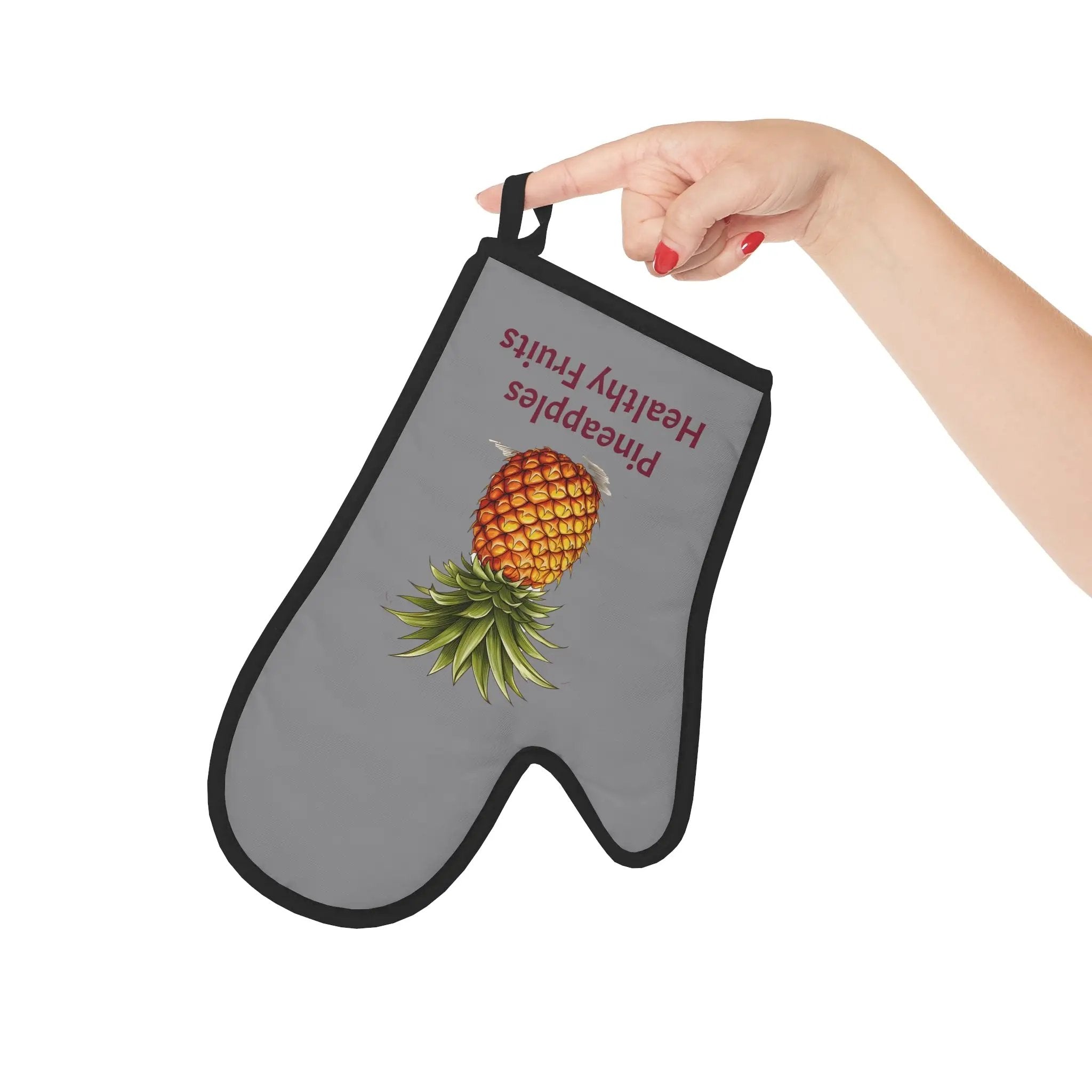 oven mitt | a person holding a bag with a picture of a pineapple on it