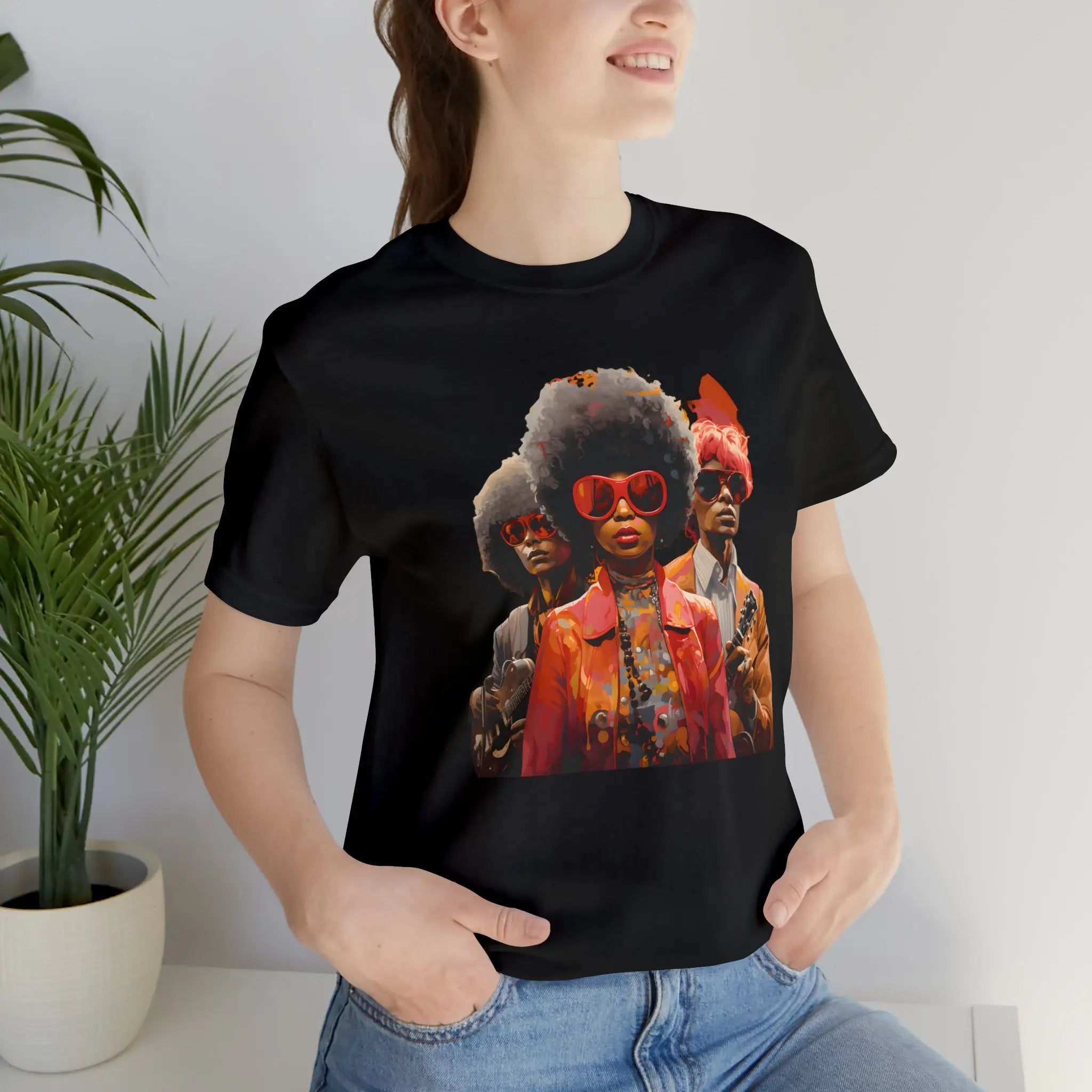 Couple t shirt | a woman wearing a black t - shirt with a picture of two black men