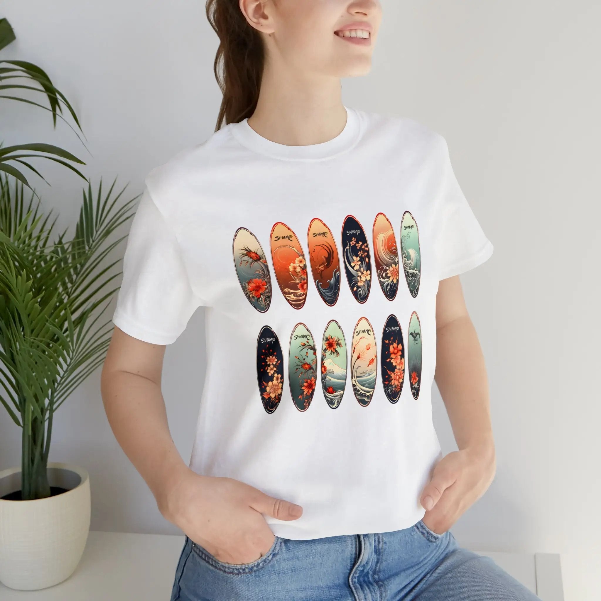 Couple t shirt | a woman wearing a white t - shirt with a picture of surfboards on it