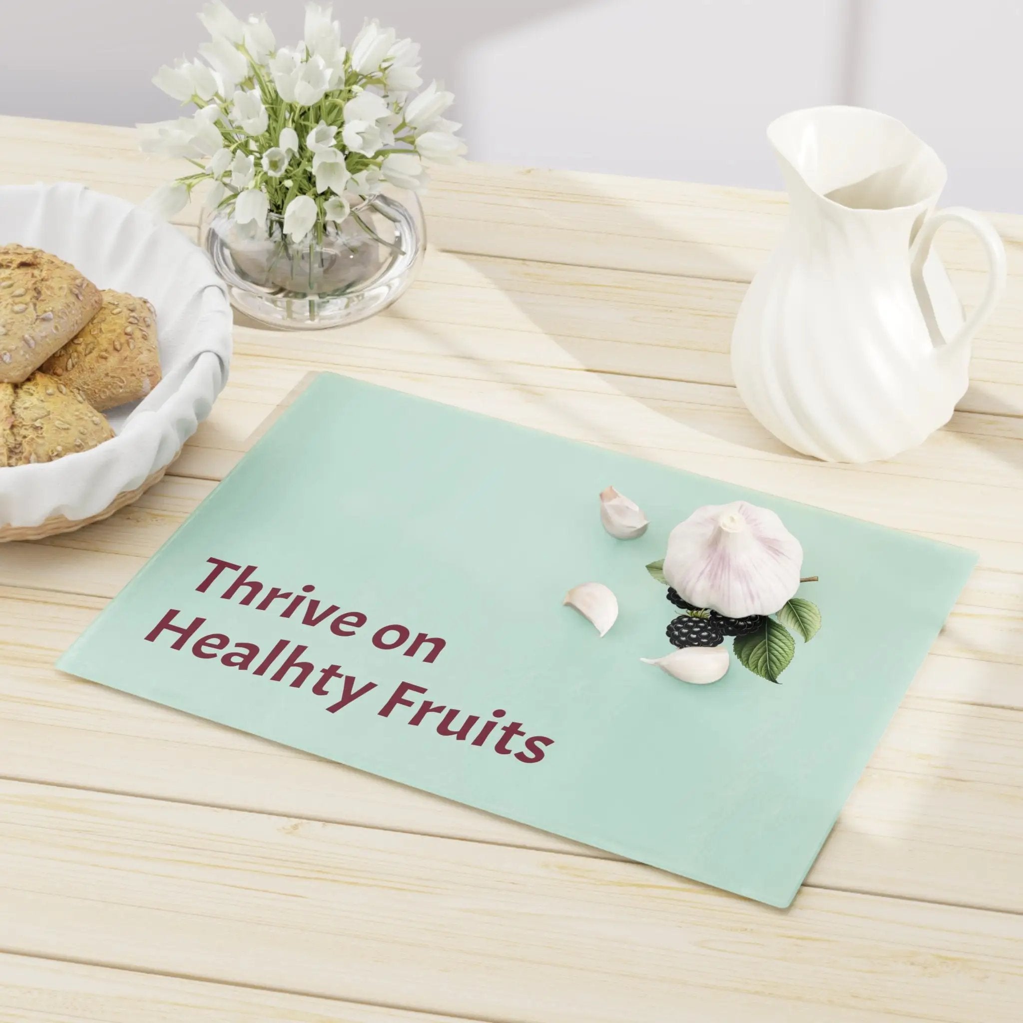 Cutting board | a table topped with a bowl of cookies and a plate of cookies