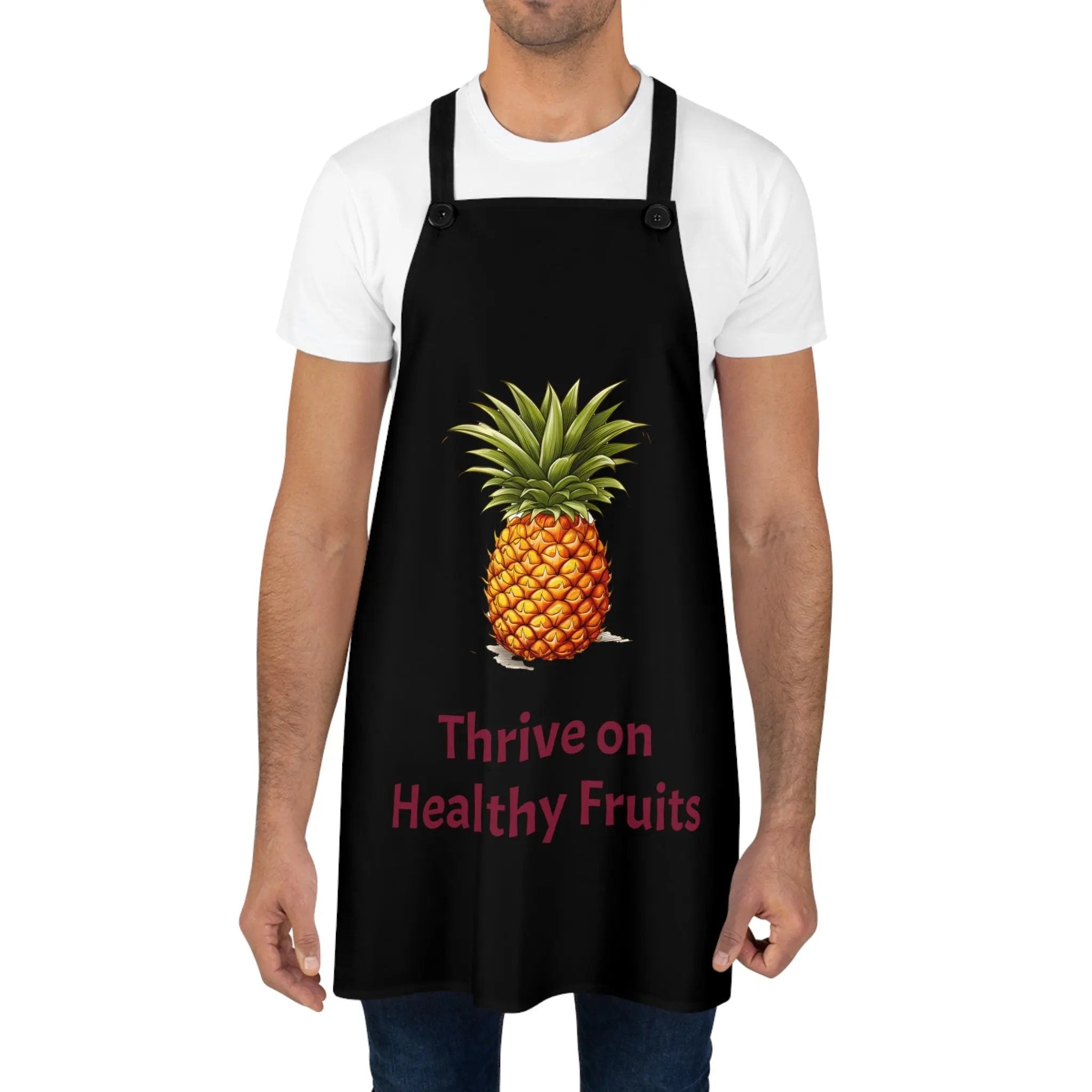 Chef Apron | a man wearing a black apron with a pineapple on it