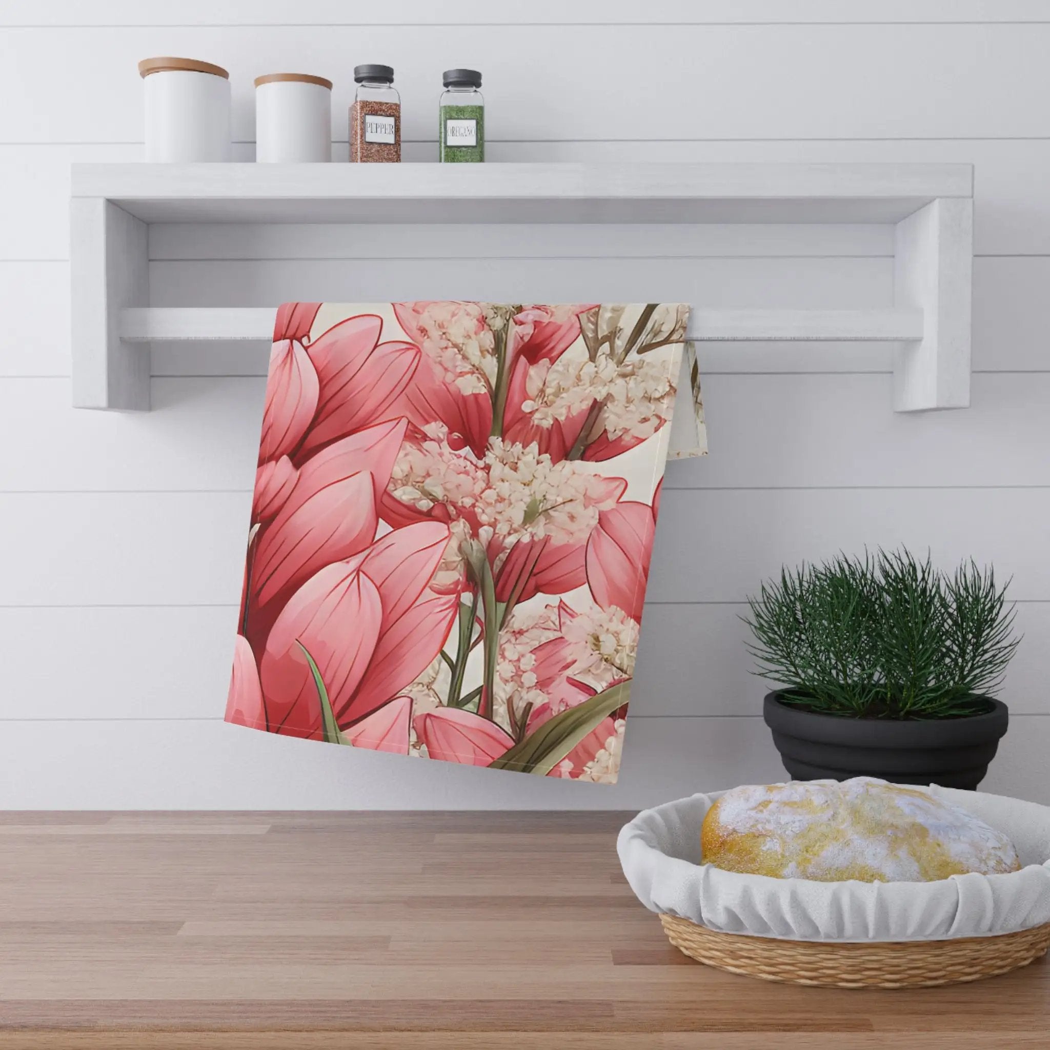 Kitchen Towel | a kitchen counter with a potted plant and a towel hanging on the wall