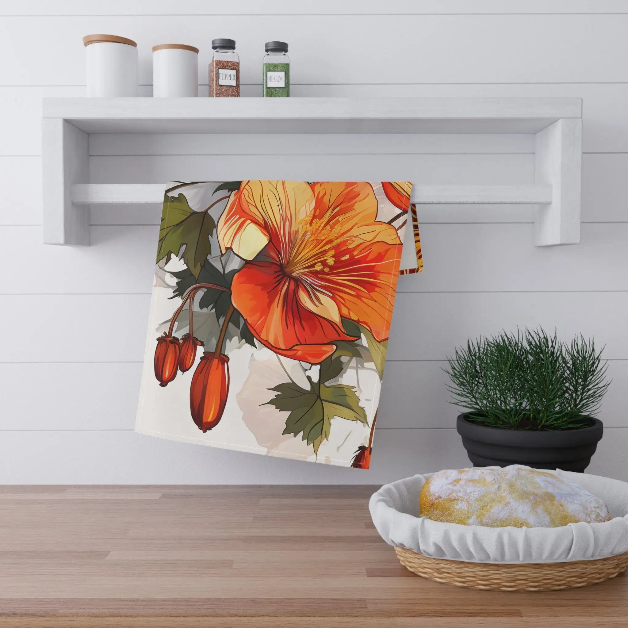 Kitchen Towel | a kitchen counter with a potted plant and a towel on it