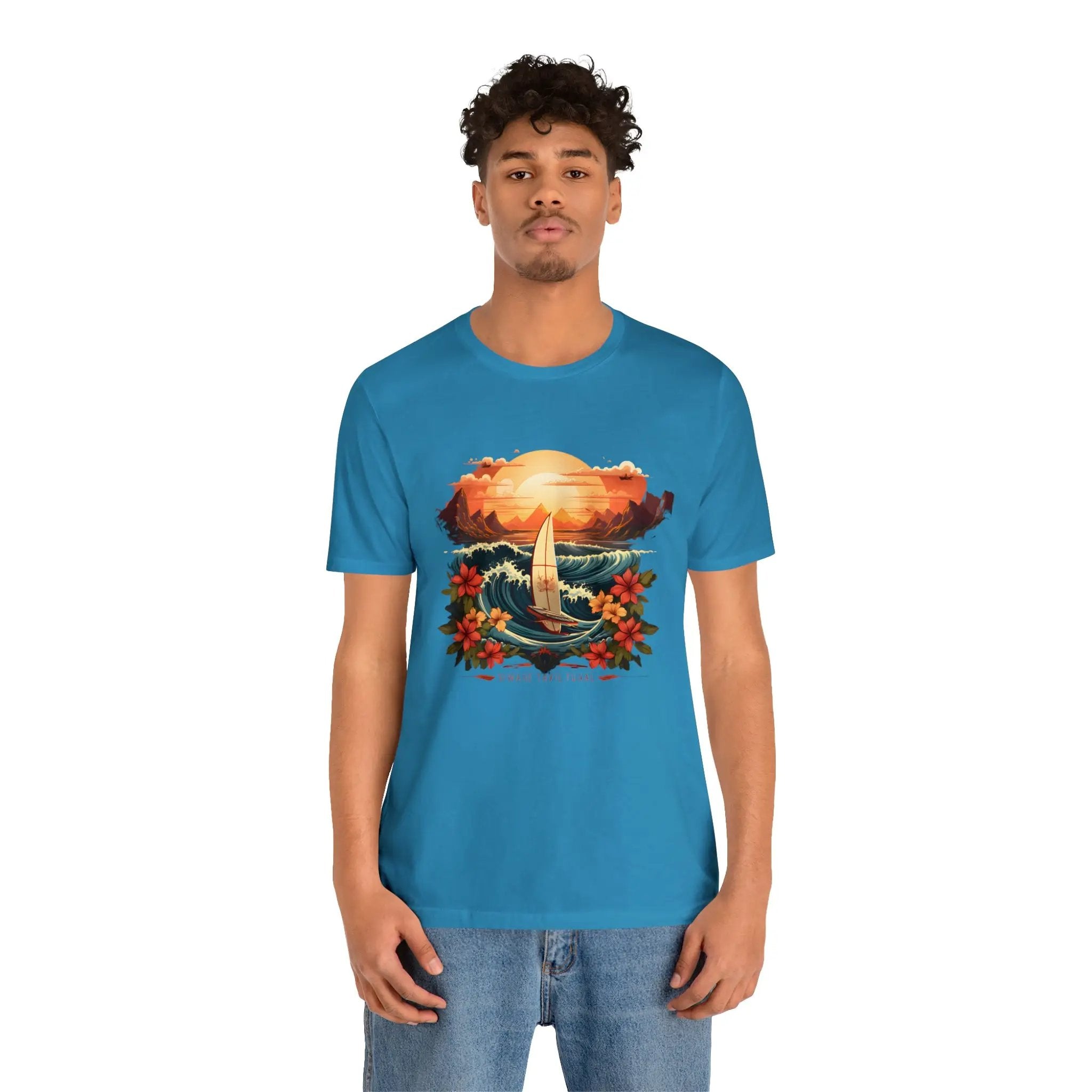 Couple t shirt | a man wearing a blue t - shirt with a picture of a sailboat on