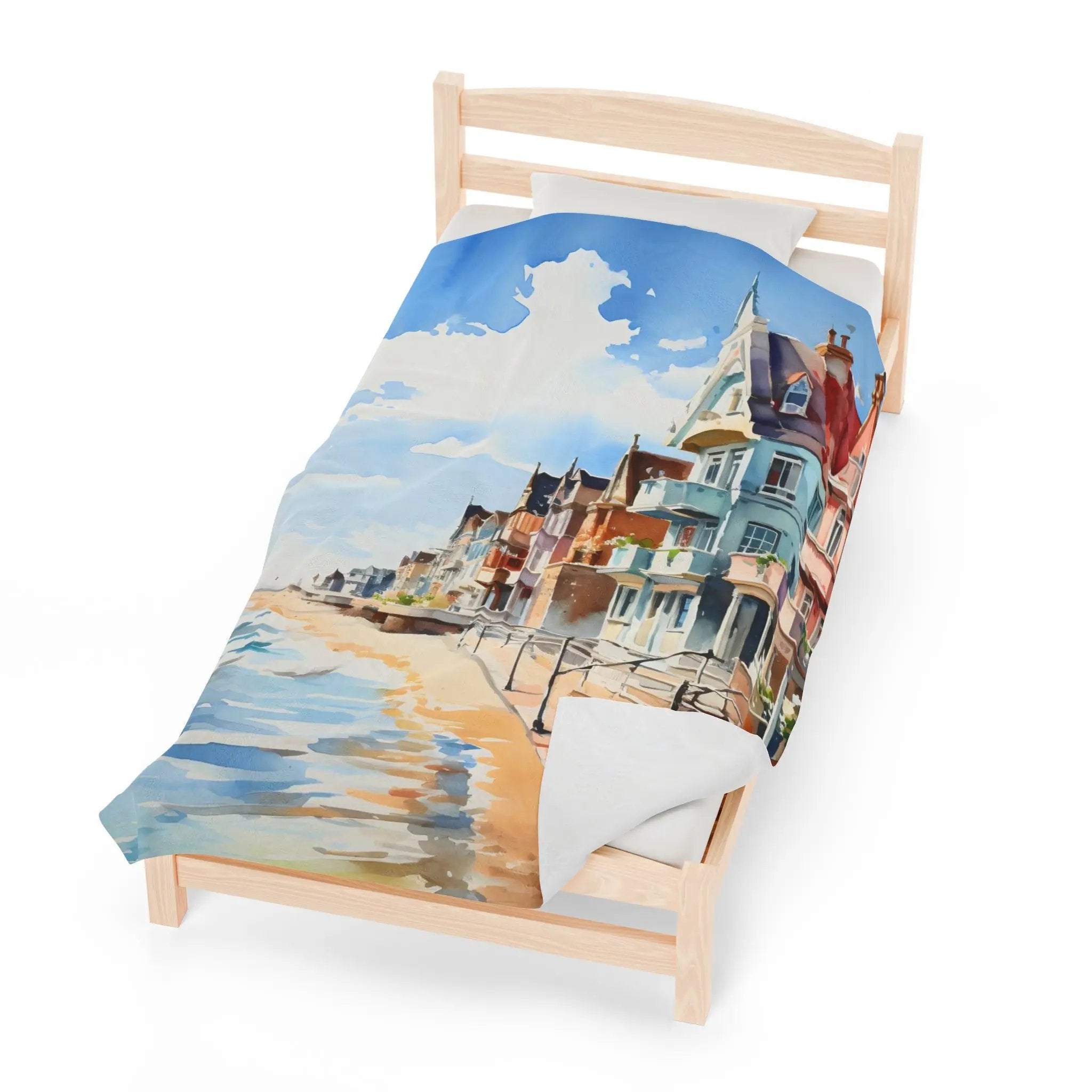 bedroom Blanket | a bed with a painting of a beach scene on it