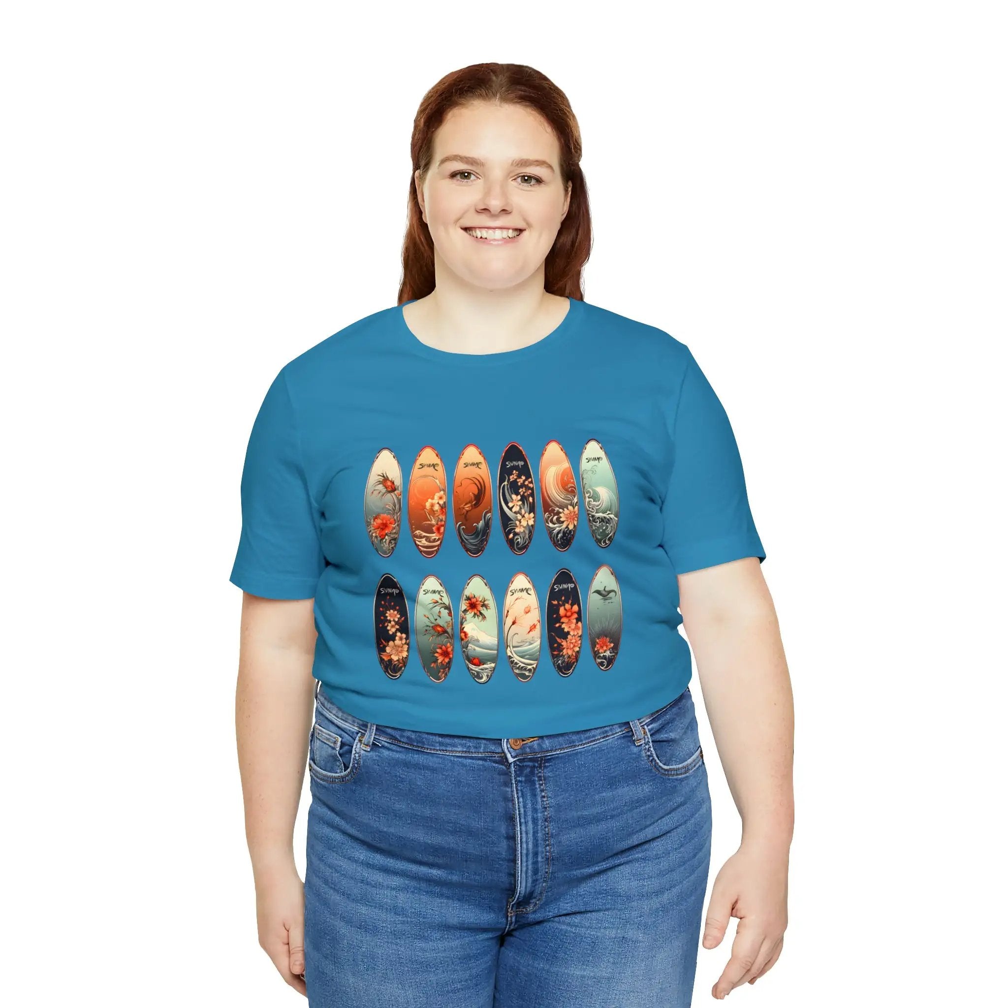 Couple t shirt | a woman wearing a blue shirt with a bunch of skateboards on it