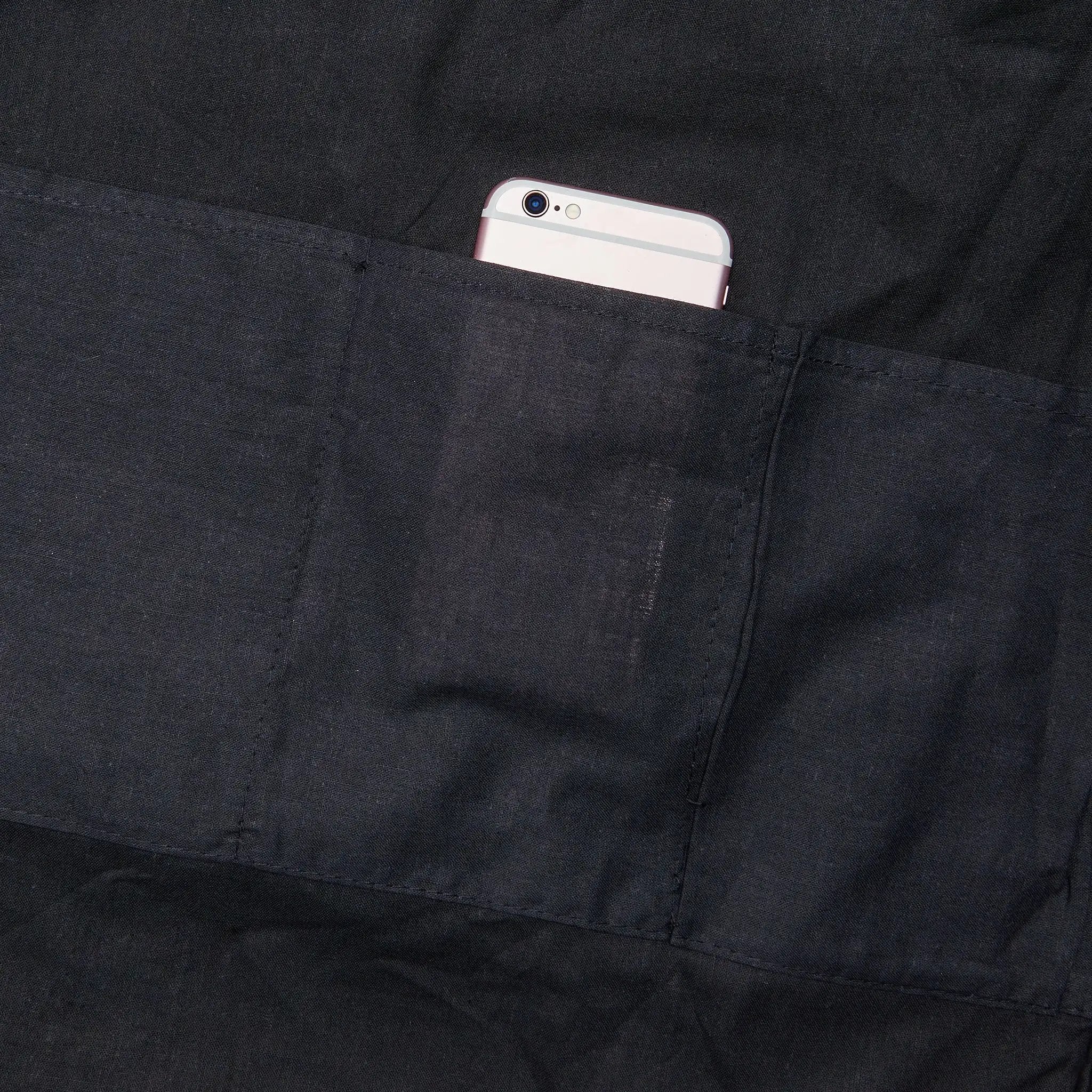 Weekender tote bag | a cell phone in the pocket of a black jacket