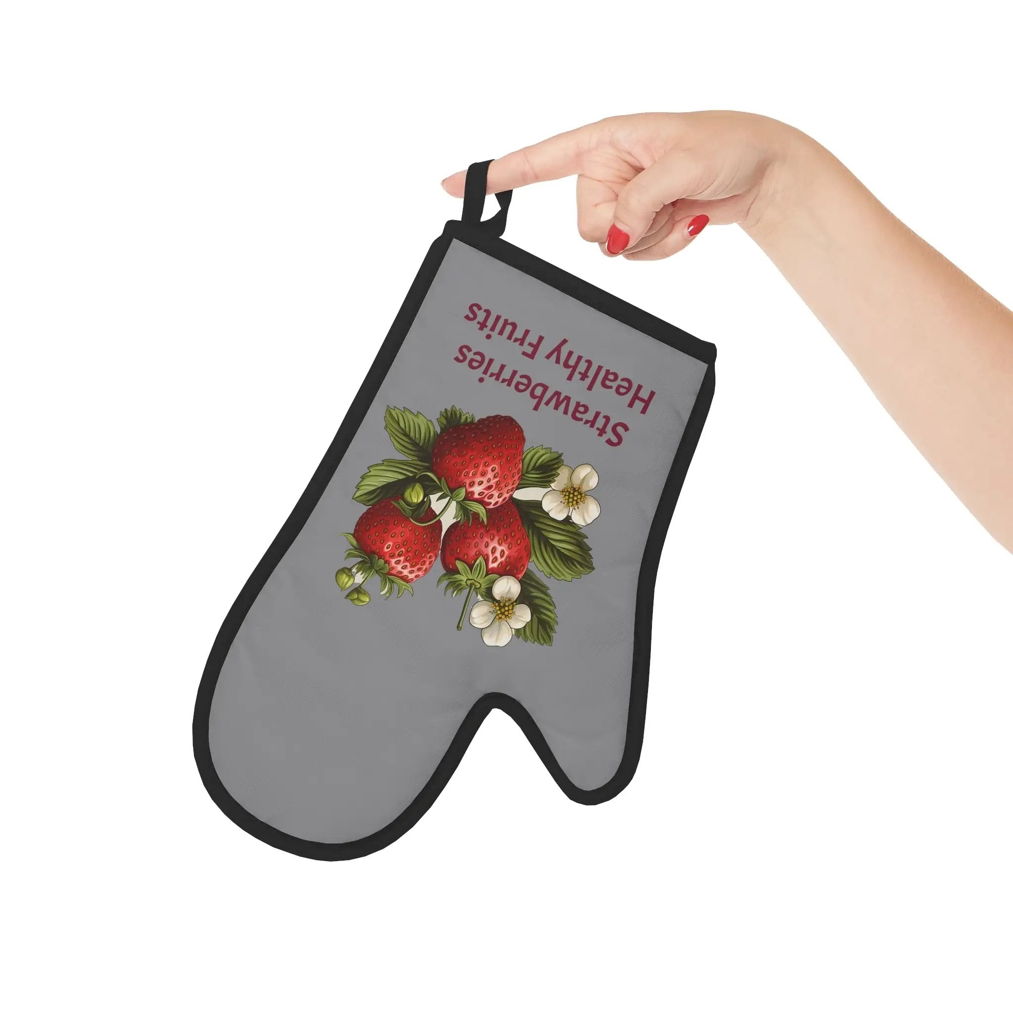 oven mitt | a hand holding a gray oven mitt with strawberries on it