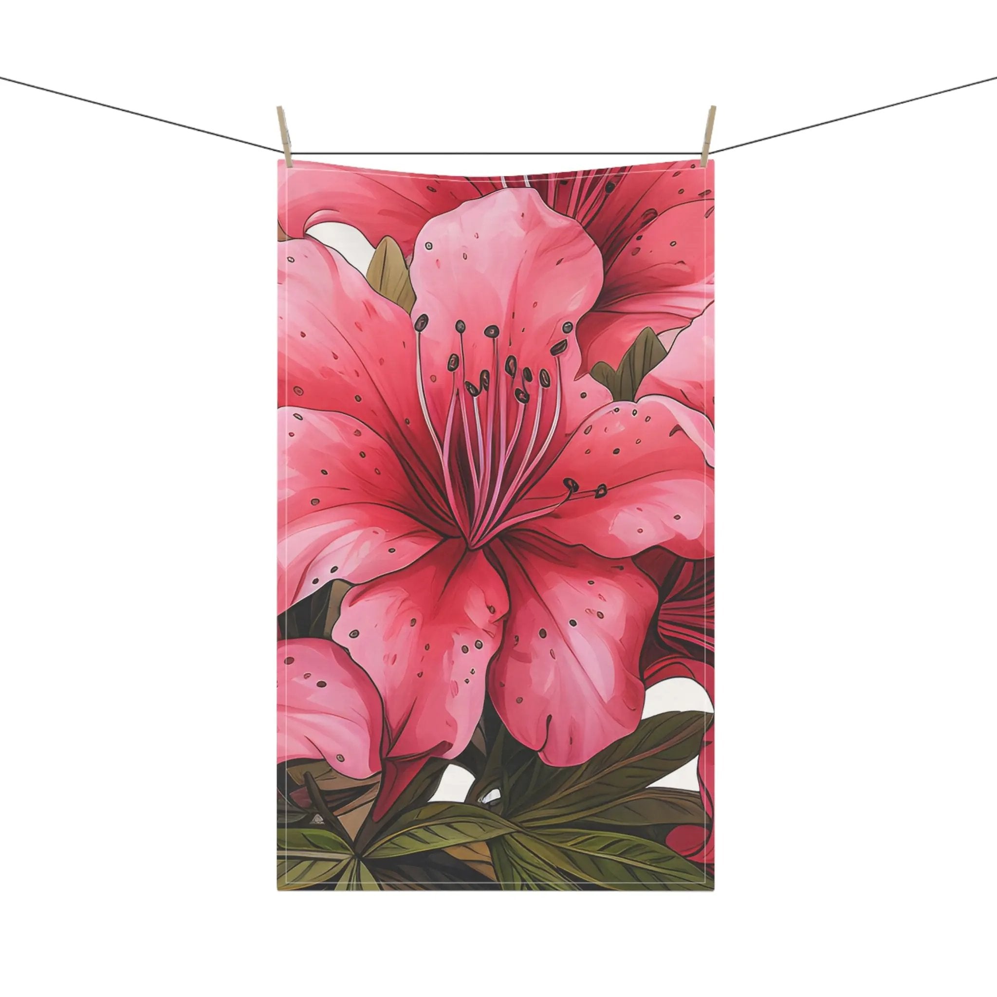 Kitchen Towel | a pink flower hanging on a clothes line