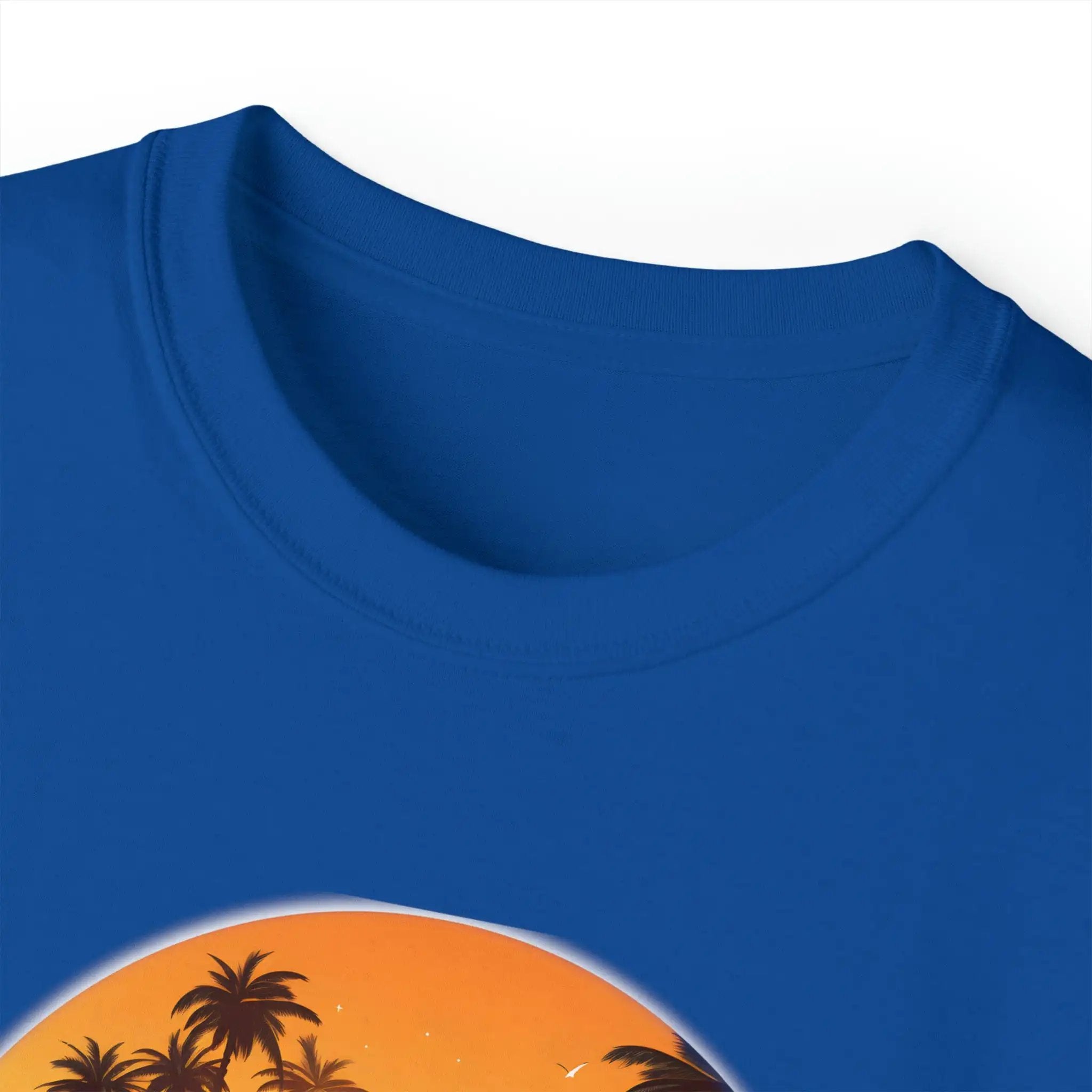 men tee graphic | a blue t - shirt with a picture of a sunset and palm trees