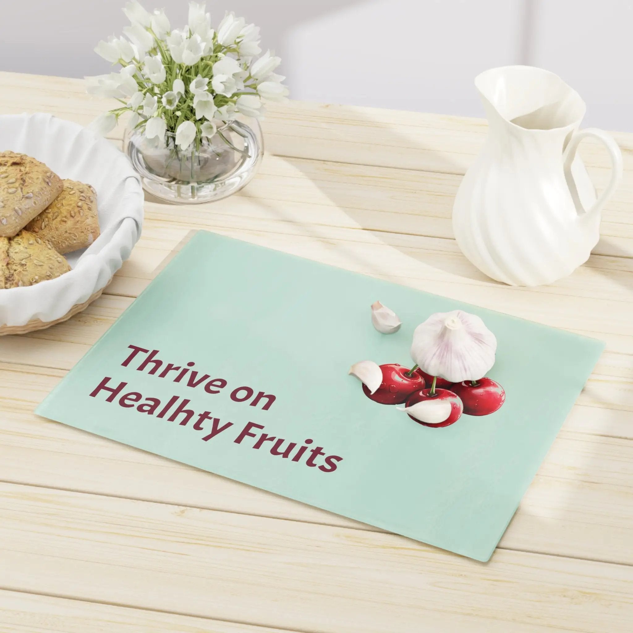 Cutting board | a table topped with a bowl of cookies and a plate of cookies