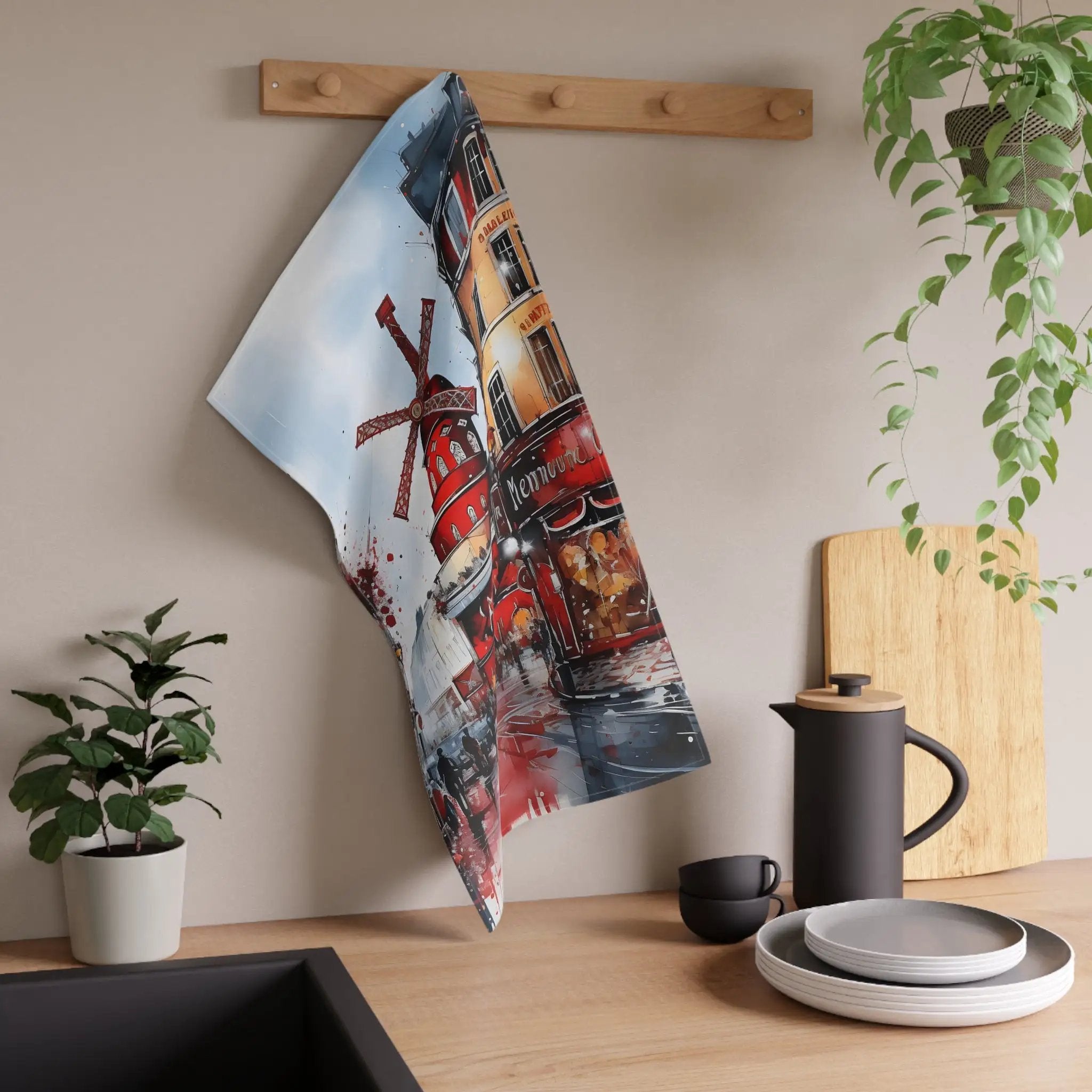 Kitchen Towel | a tea towel hanging on a wall next to a potted plant