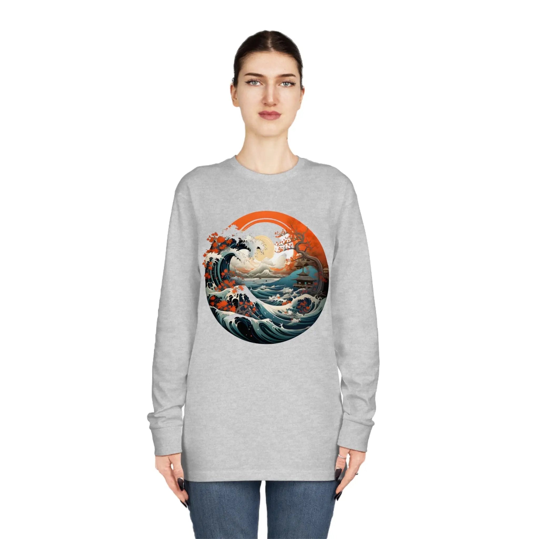 Long Sleeve t shirt | a woman wearing a sweatshirt with an image of a wave in the ocean