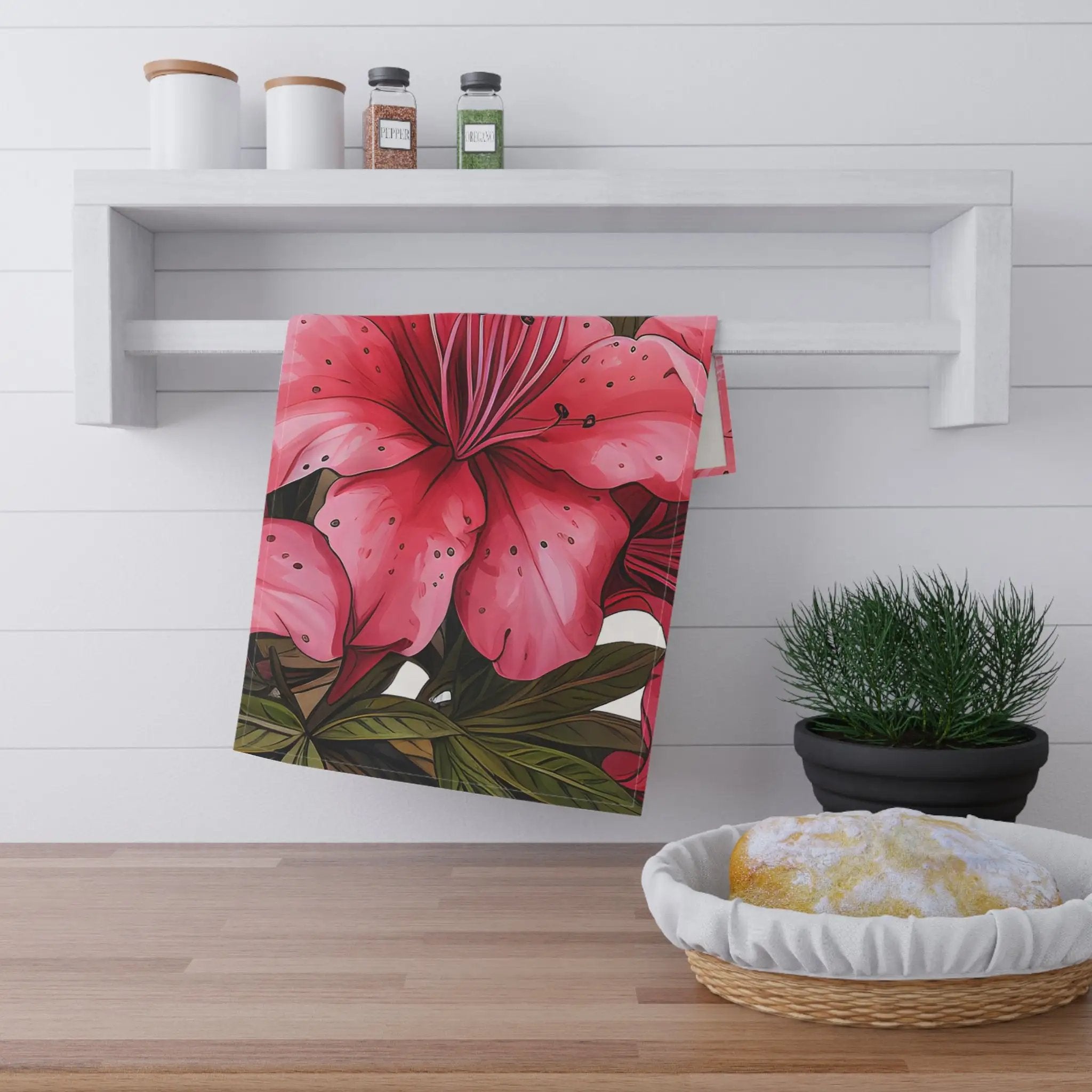 Kitchen Towel | a pink flower is hanging on a wall