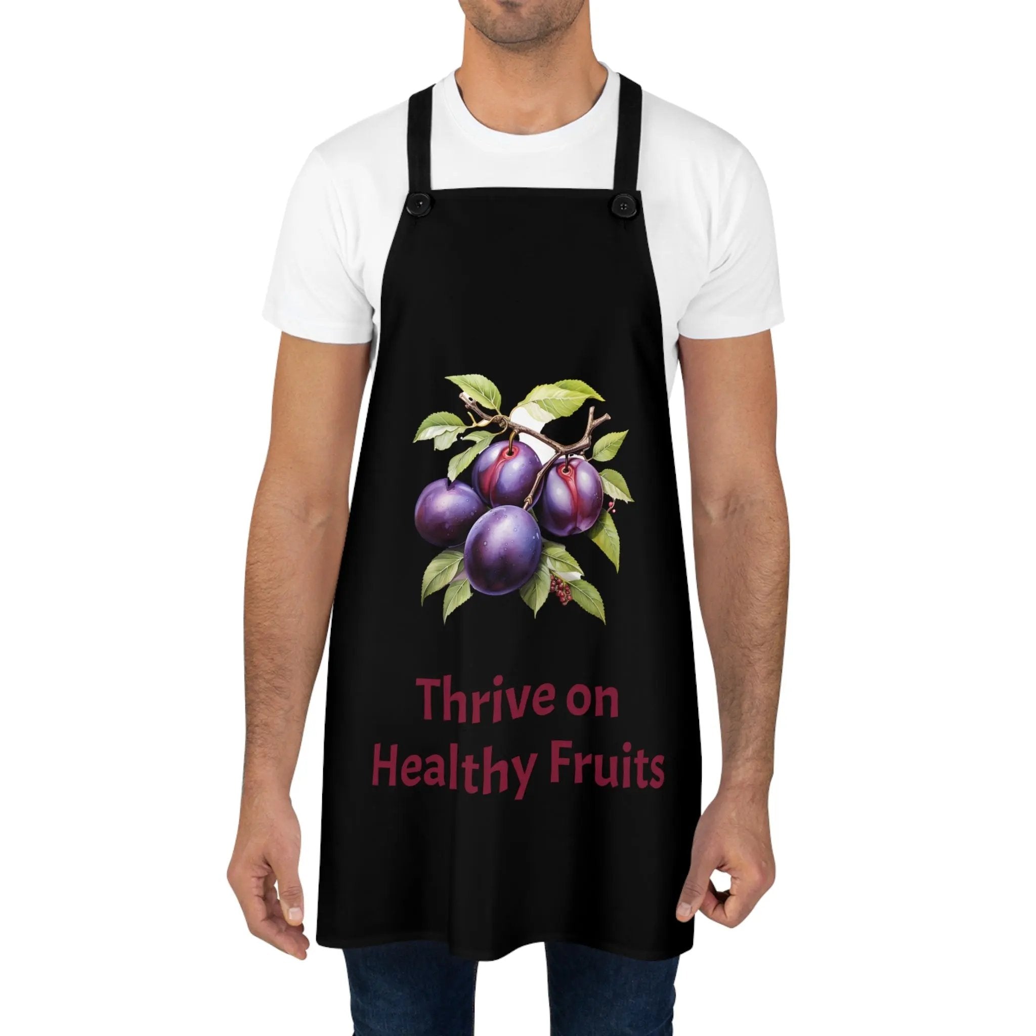 Chef Apron | a man wearing a black apron with fruit on it