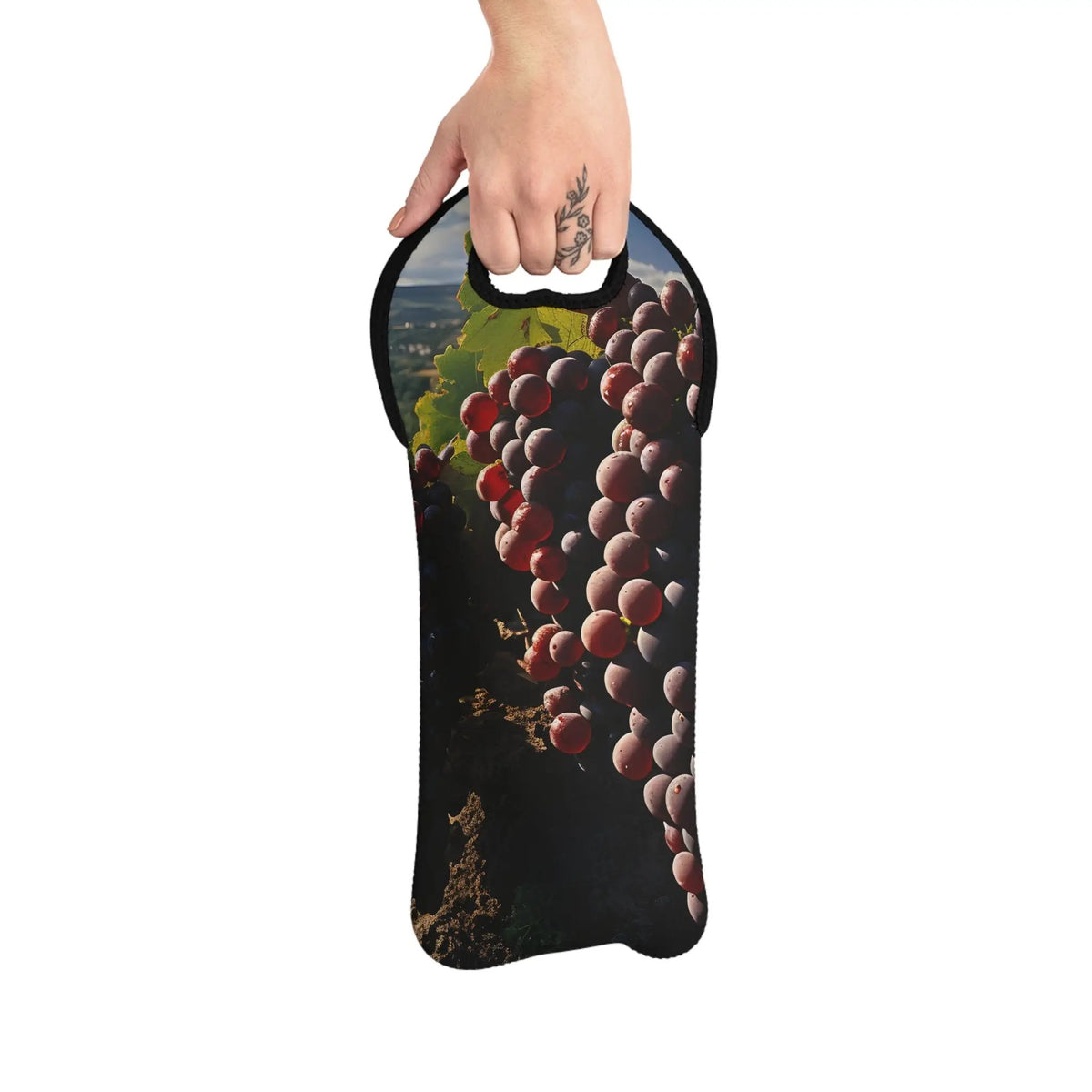 Wine Bags | a hand holding a wine bottle cover with a bunch of grapes on it