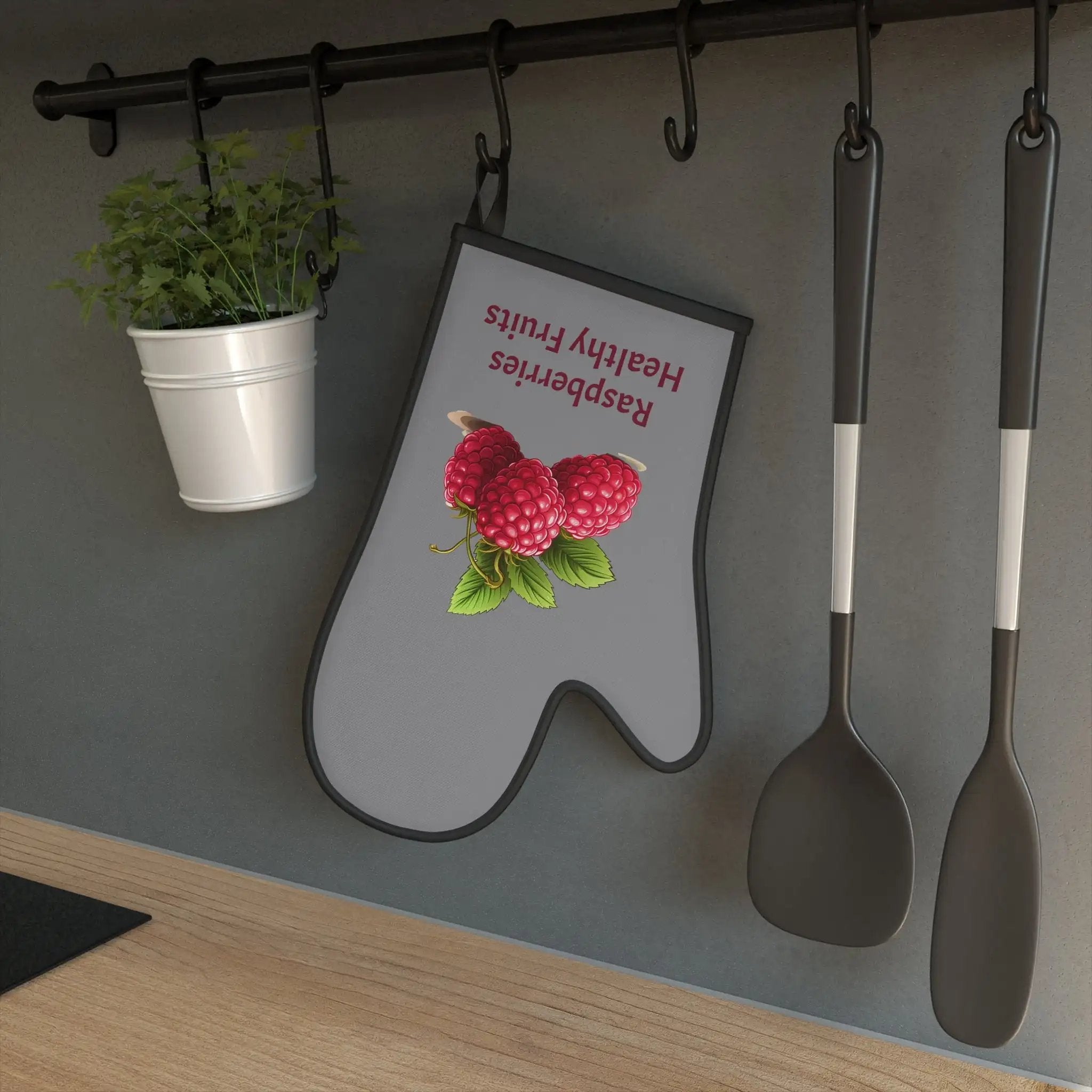 Oven Mitt |a kitchen wall with spoons, spatulas and Oven Mitt