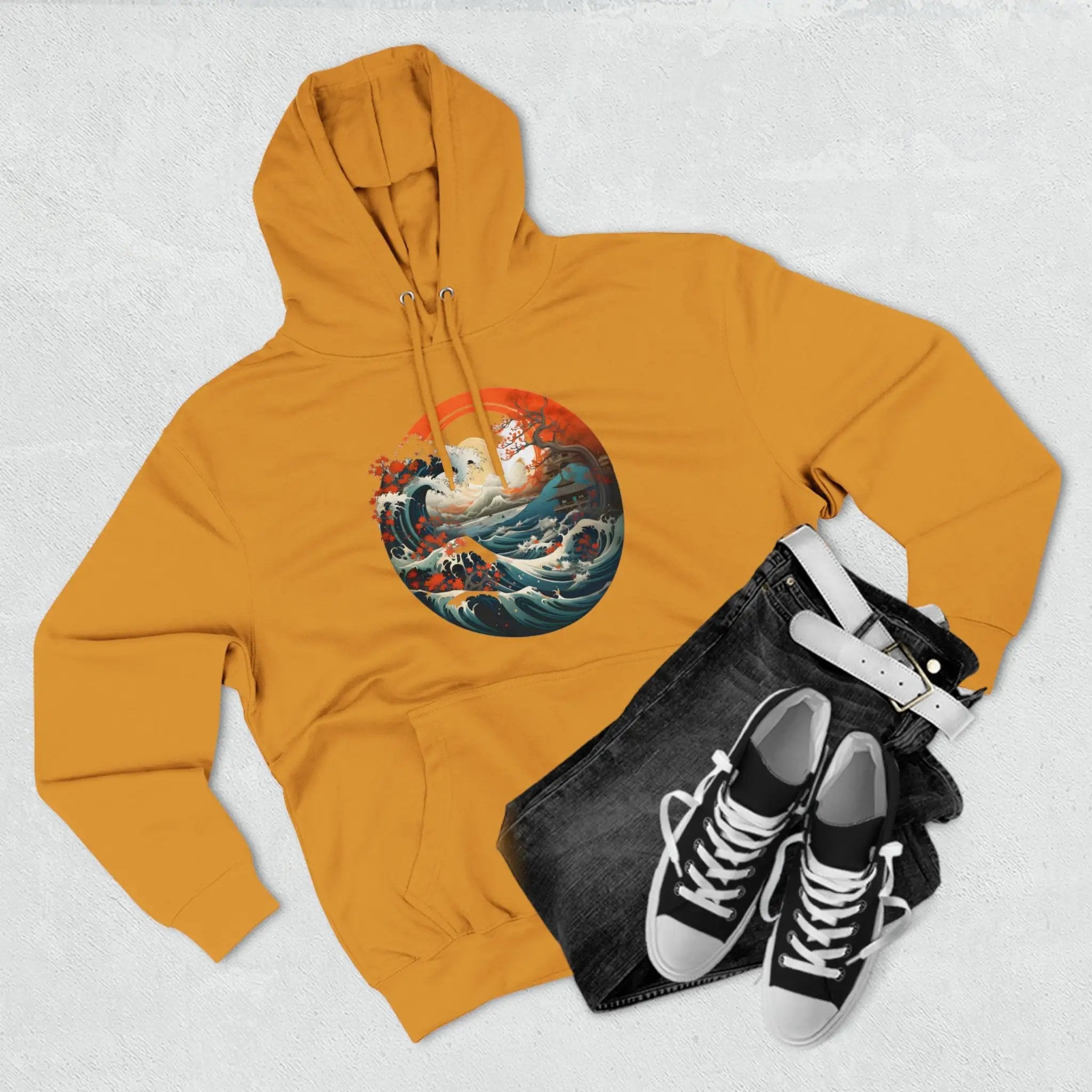 pullover hoodie | a yellow hoodie with a picture of a ship on it and a pair of