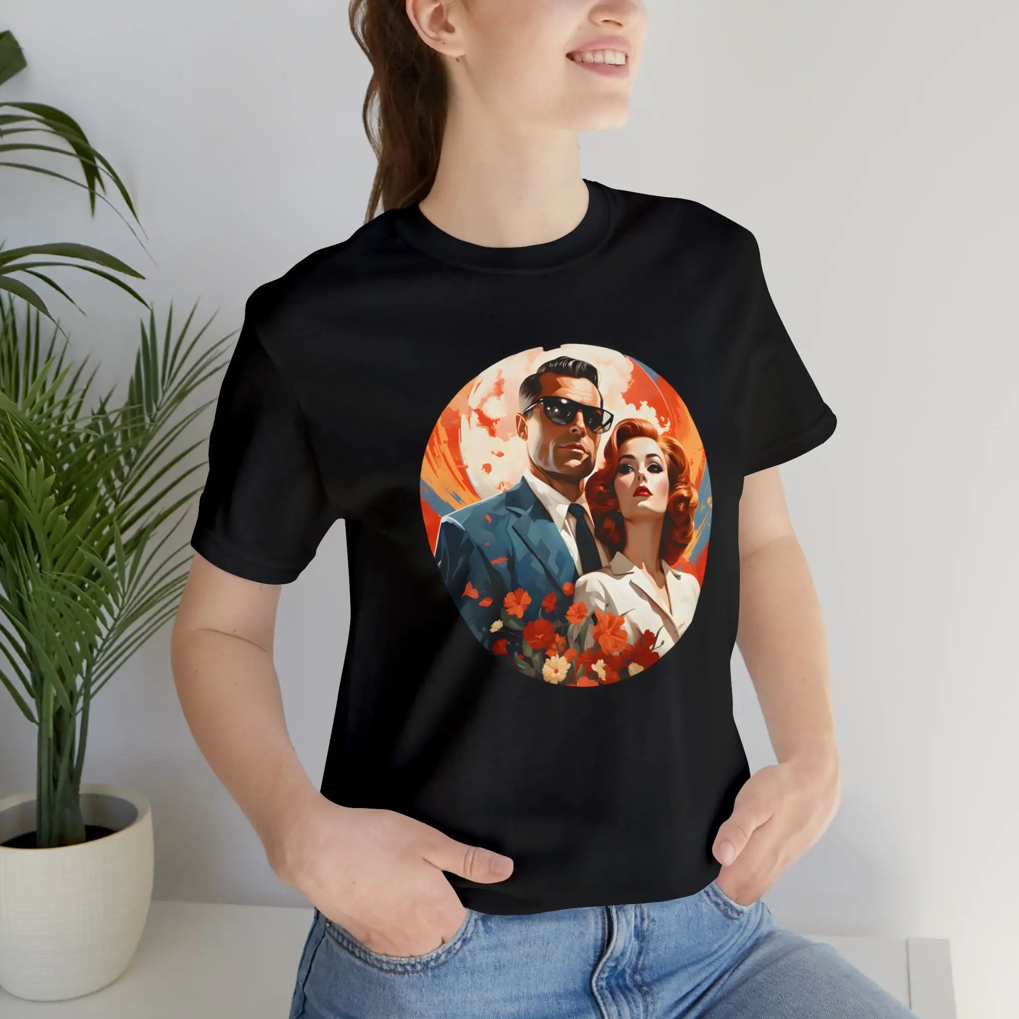 Couple t shirt | a woman wearing a black t - shirt with a picture of a man and woman