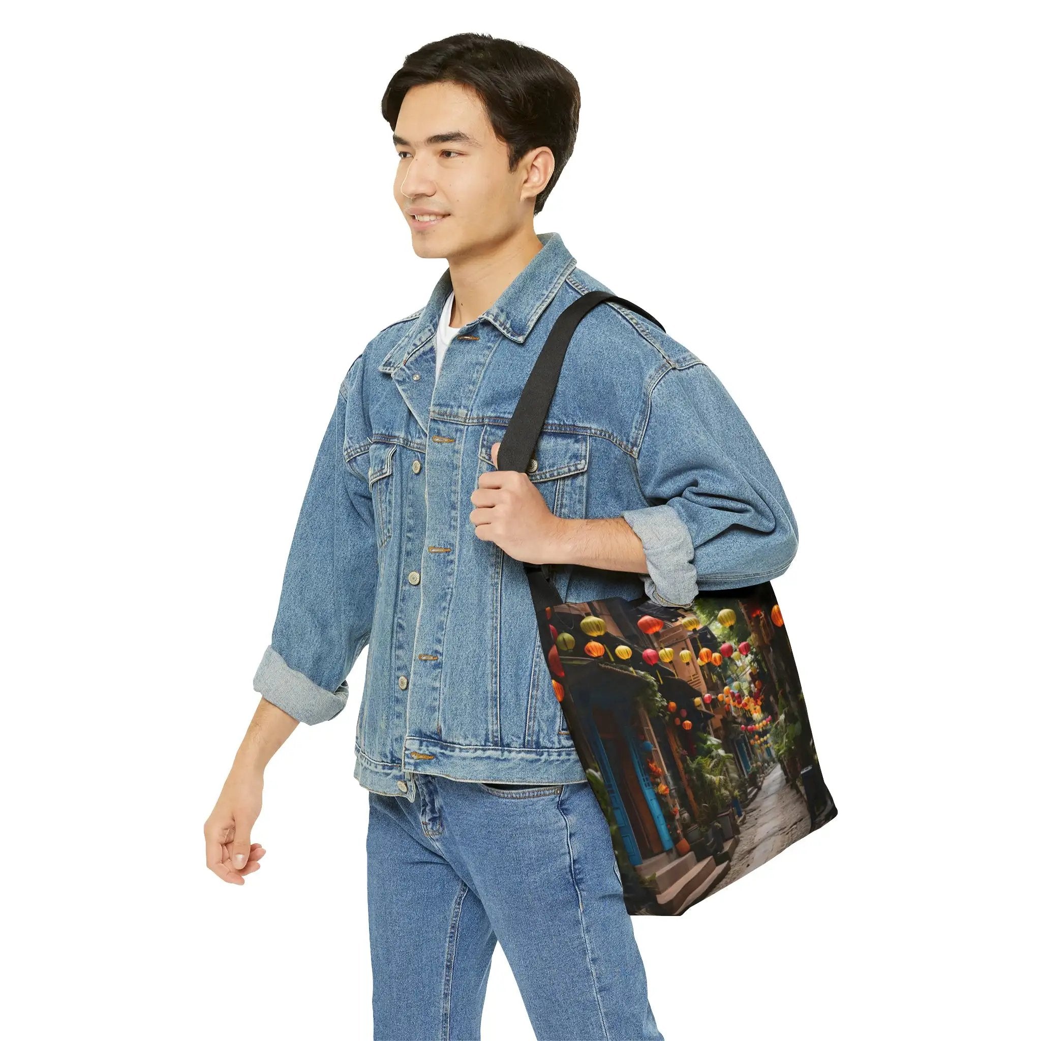 Weekender tote bag | a man in a jean jacket carrying a bag