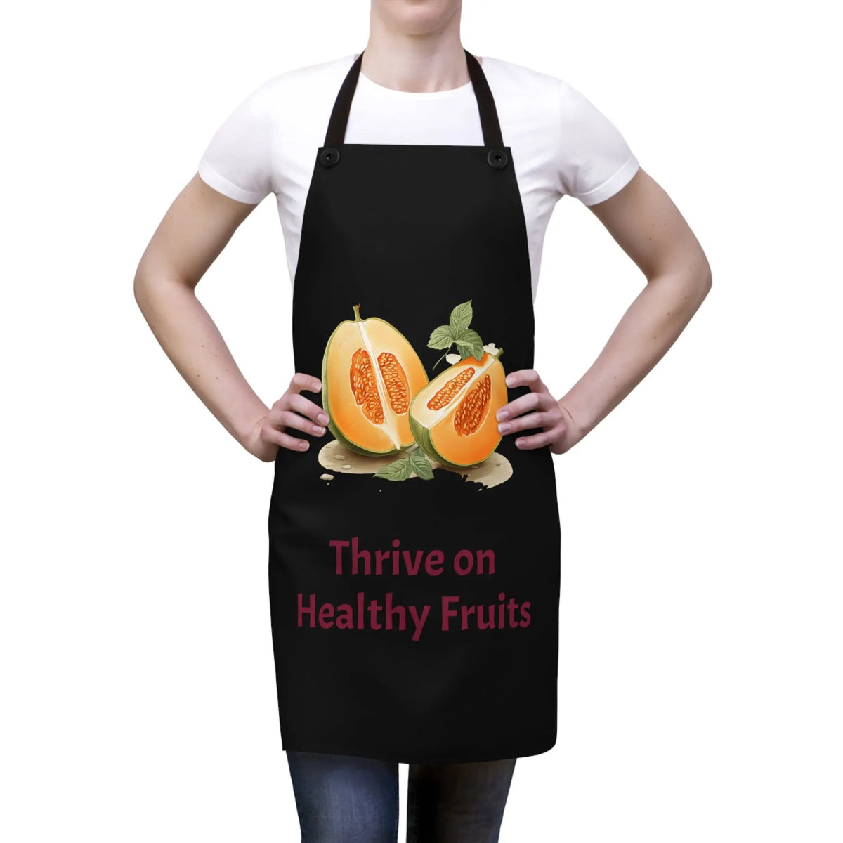 Chef Apron | a woman holding a black apron with a picture of two oranges on it