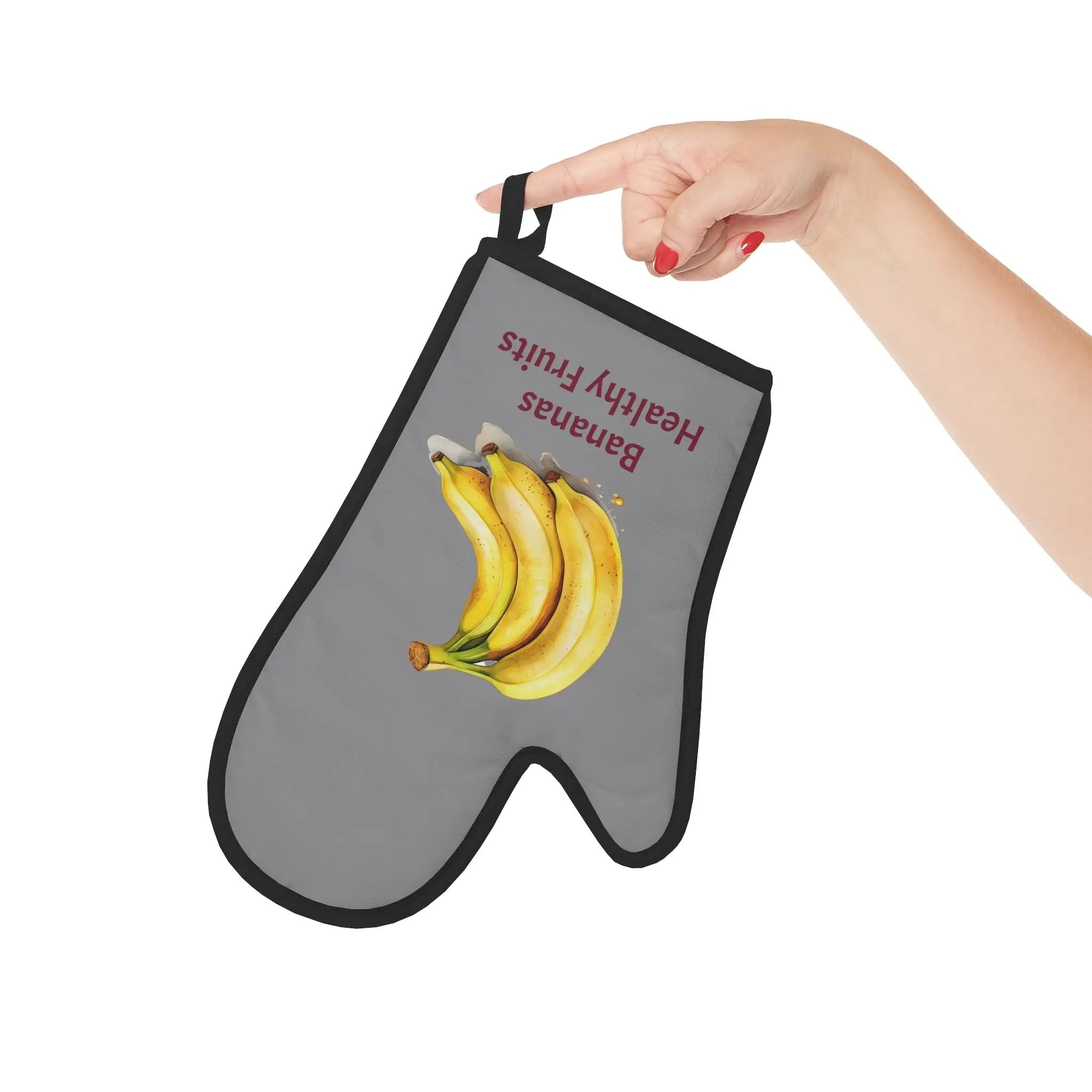 oven mitt | a person holding up a oven mitt with a bunch of bananas on it